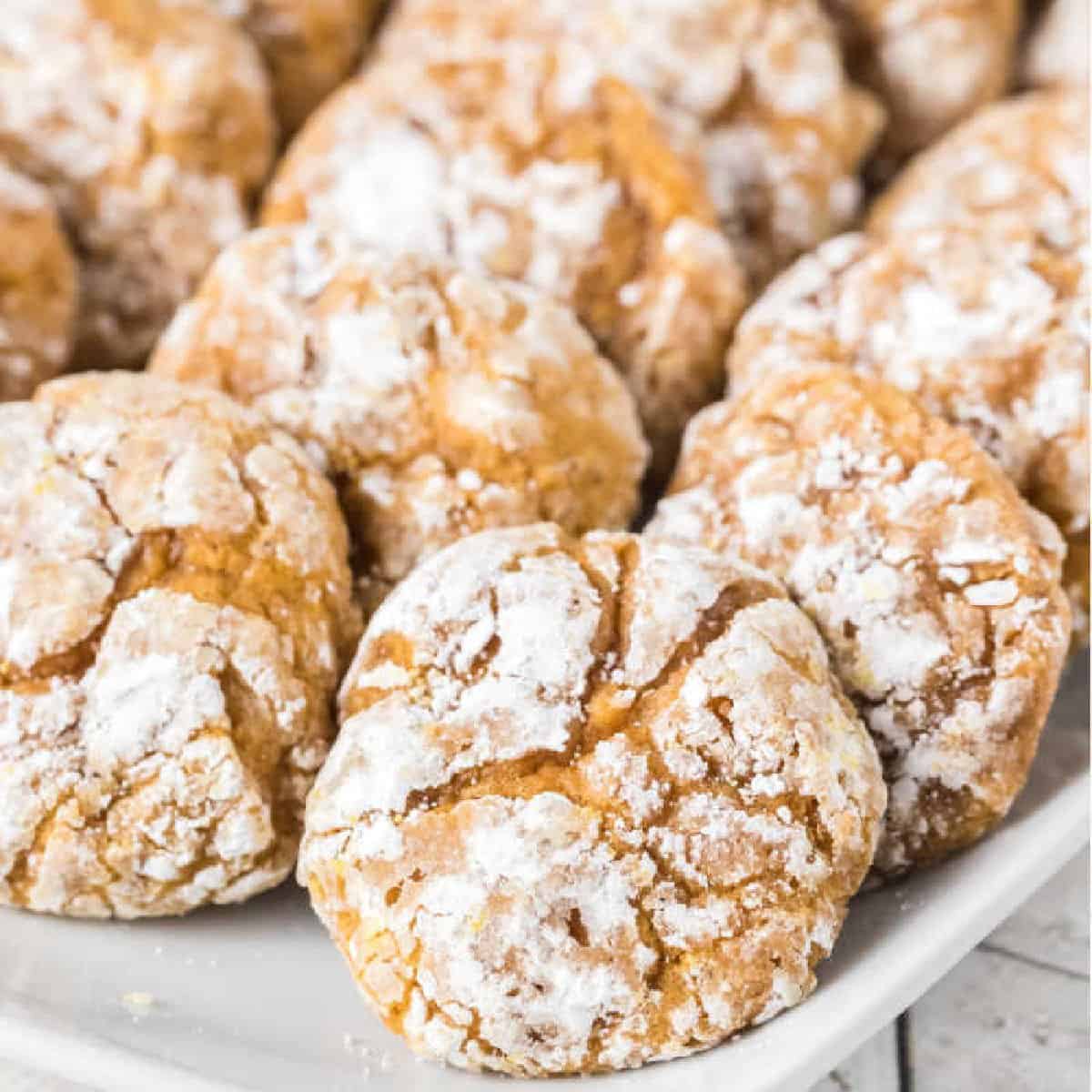 Pumpkin Cookies topped with powdered sugar on a platter
