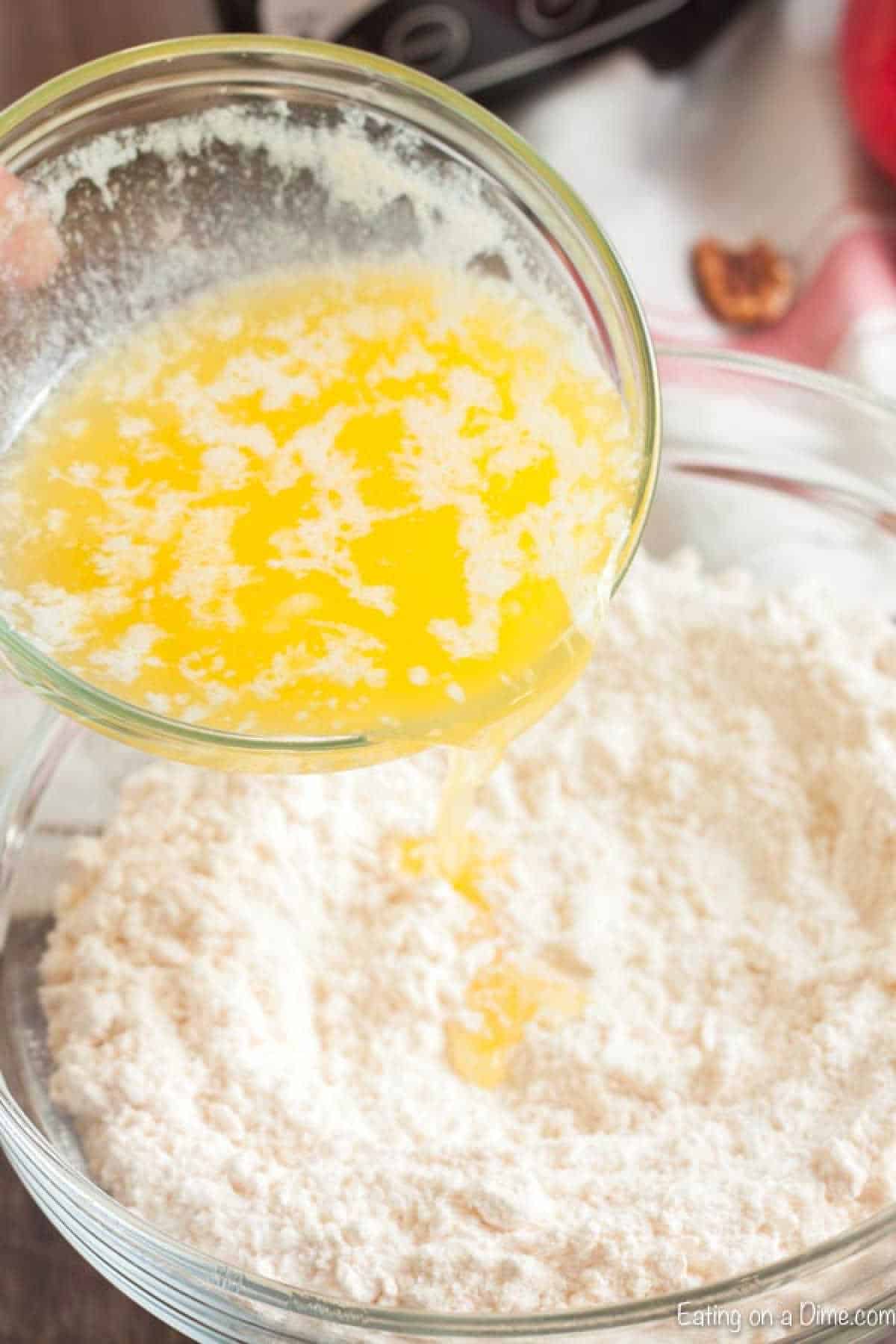 Mixing the melted butter and flour in a bowl