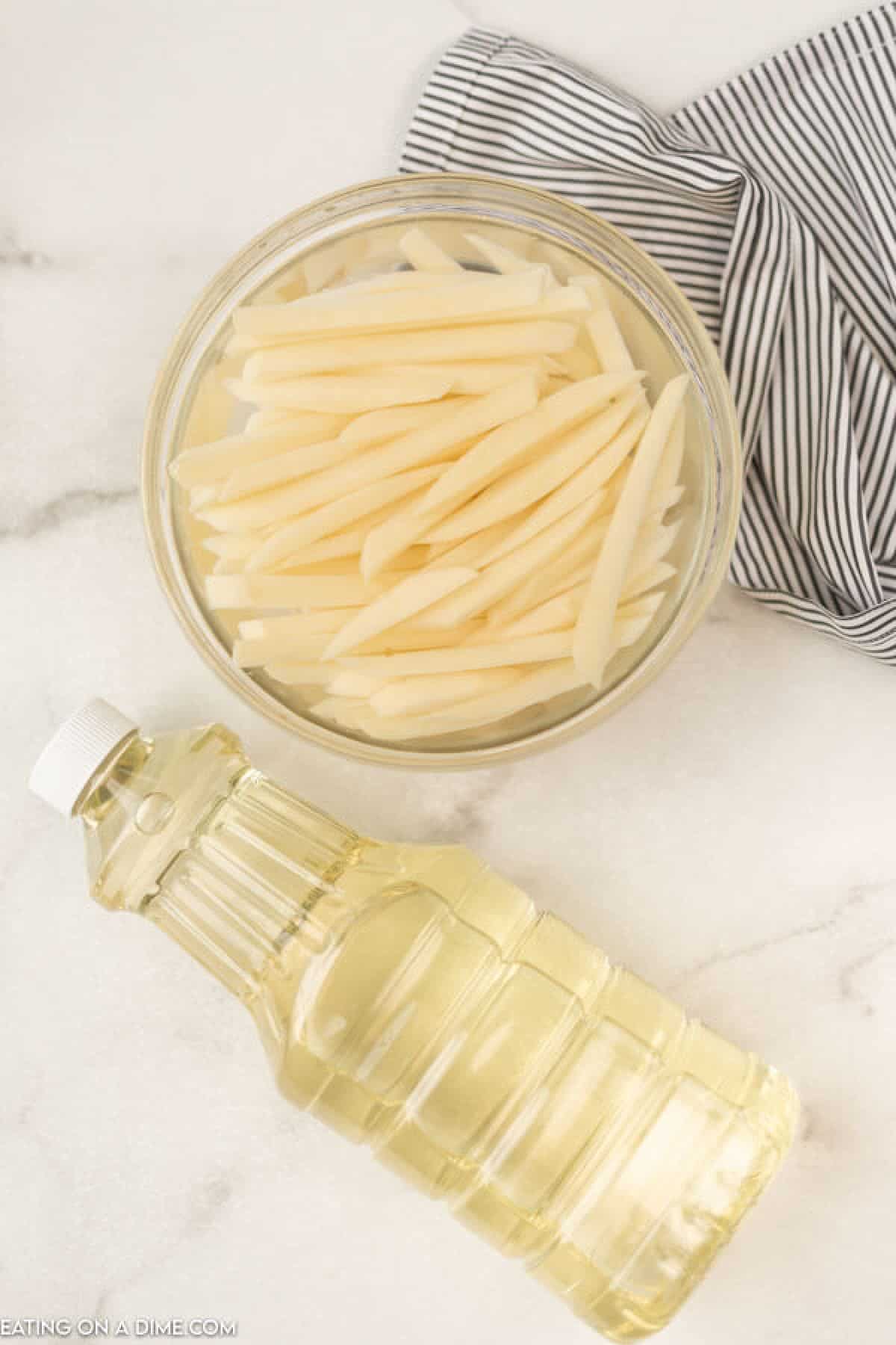 bowl of potatoes soaking in water