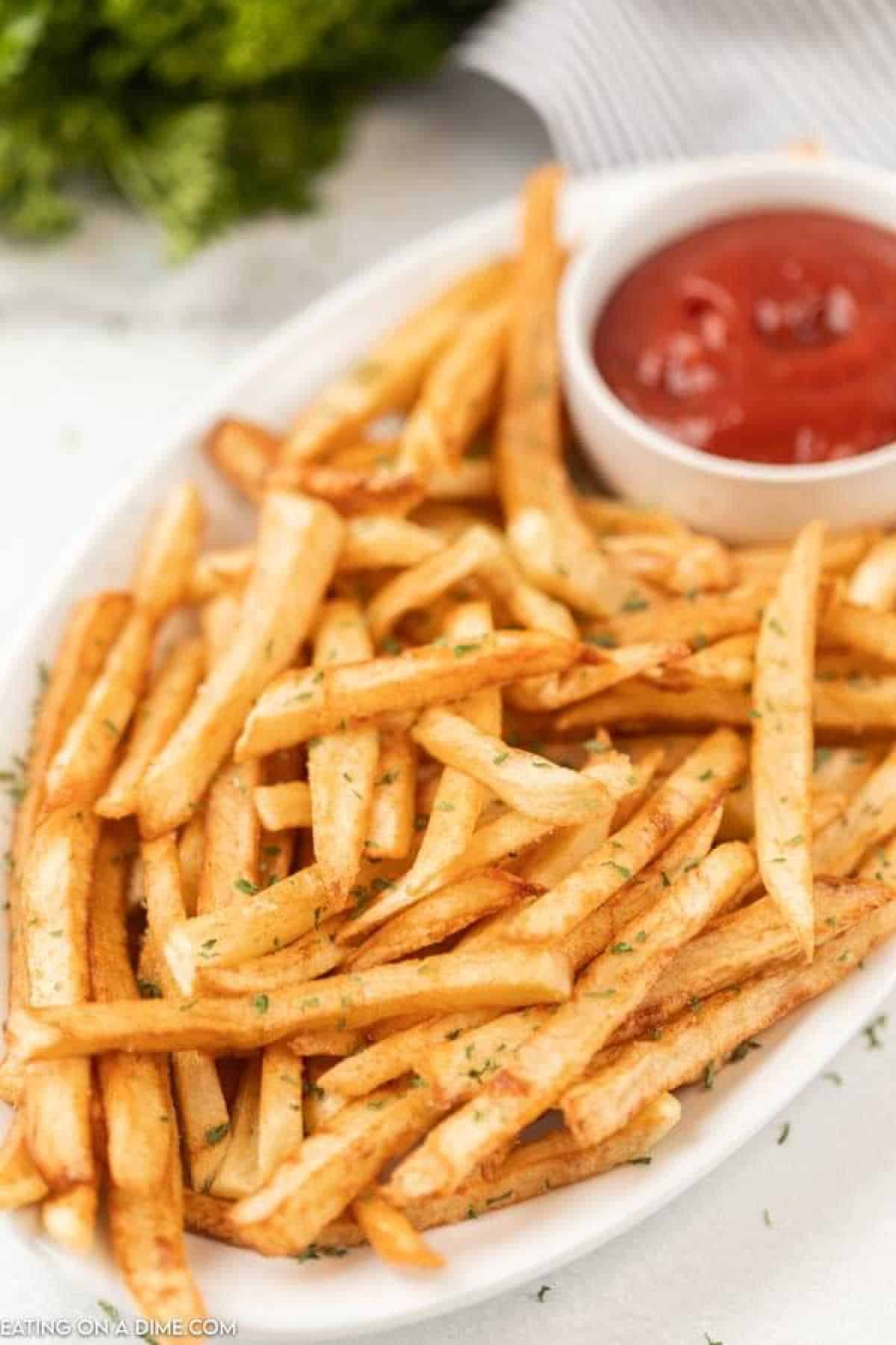 plate of french fries with ketchup 