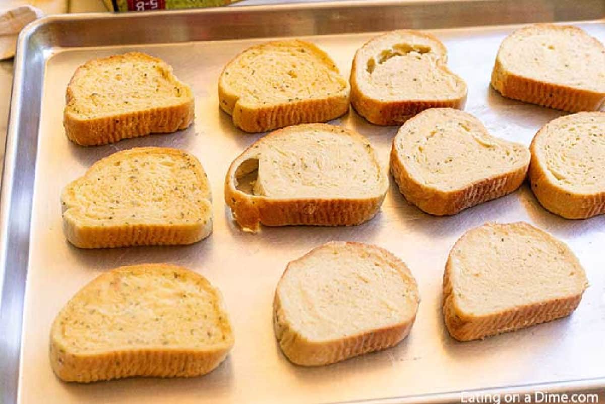 Placing Texas Toast on a baking sheet