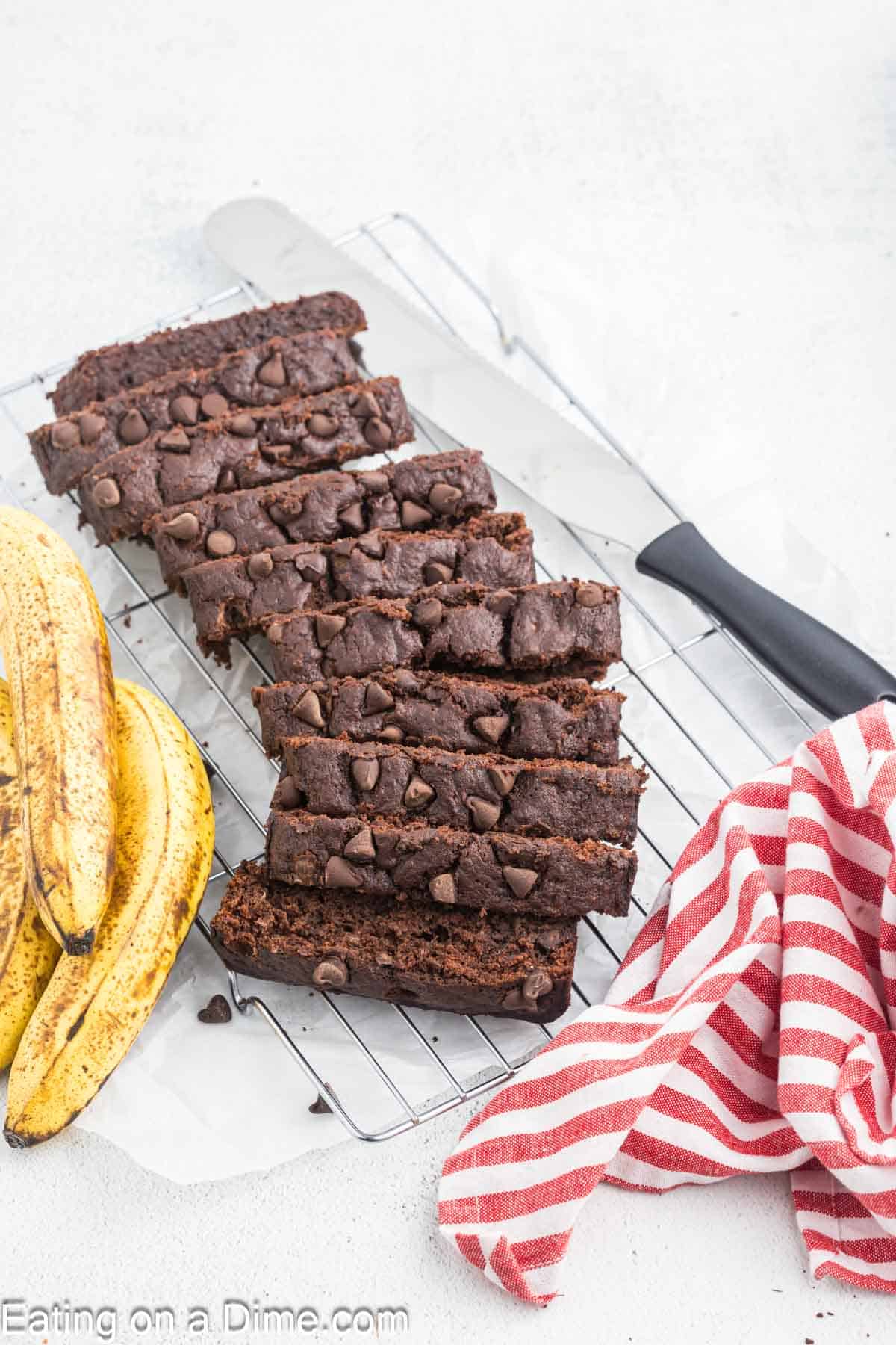 Slice chocolate banana bread on a wire rack