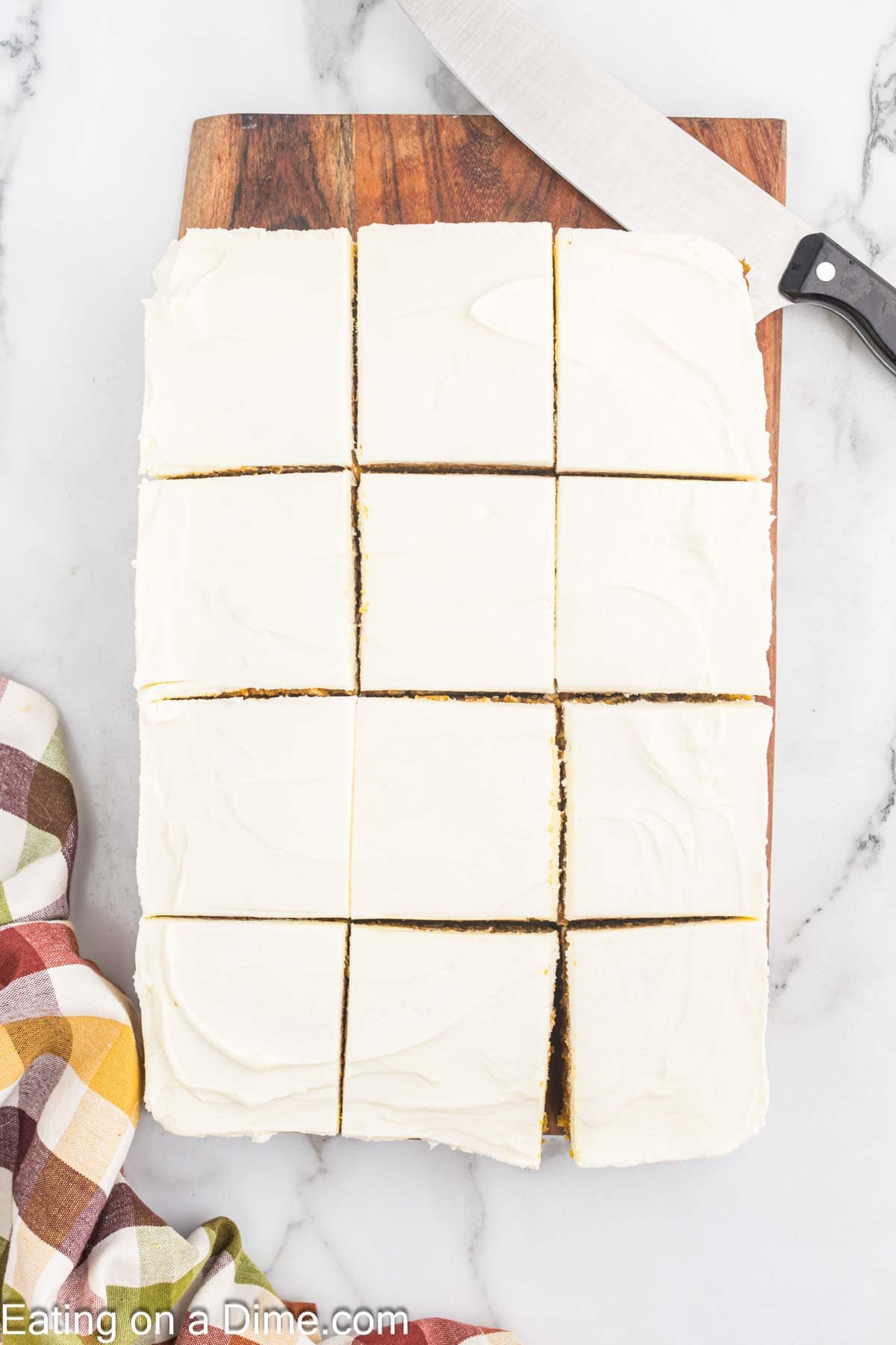 Pumpkin bars topped with cream cheese frosting