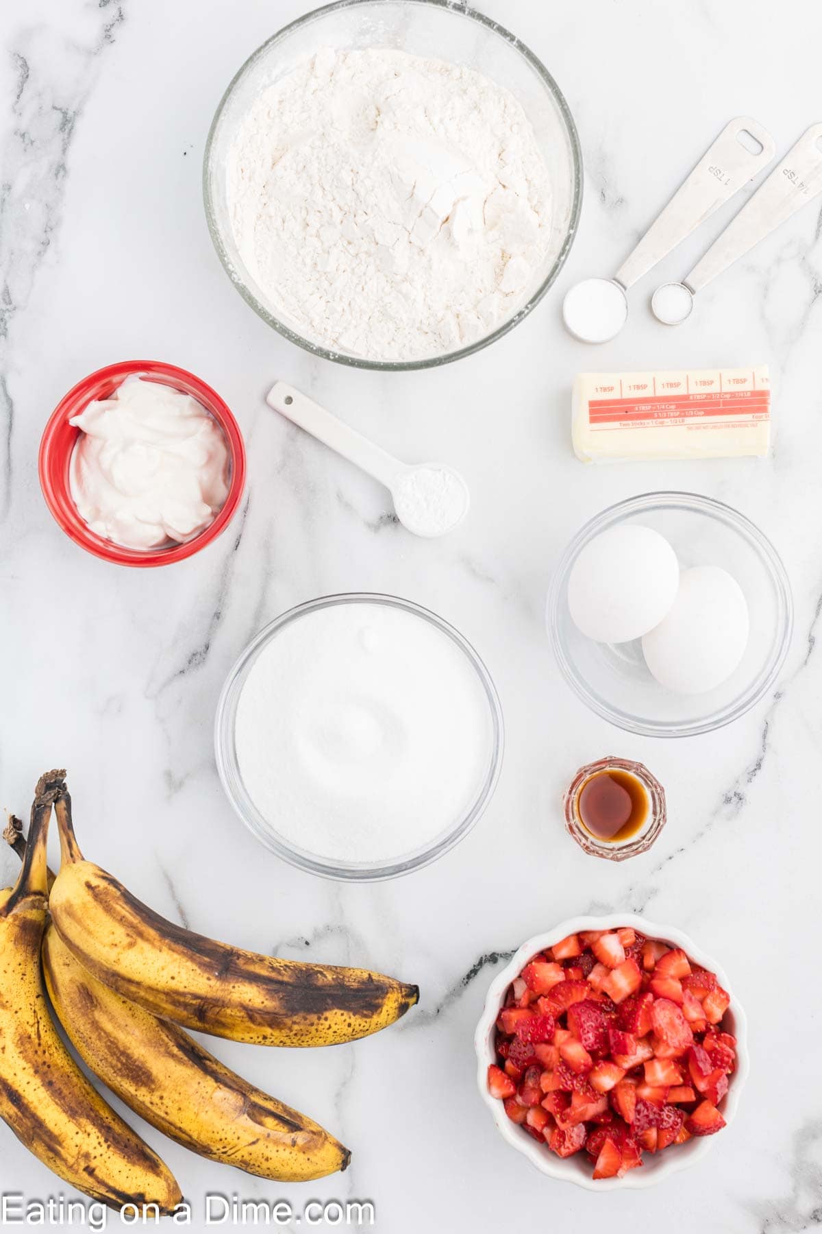 Ingredients - Flour, baking soda, baking powder, salt, sugar, butter, sour cream, bananas, eggs, vanilla extract, strawberries