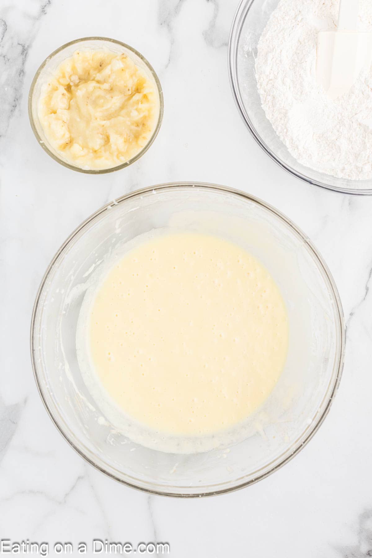 Adding in sour cream, eggs in the butter mixture 