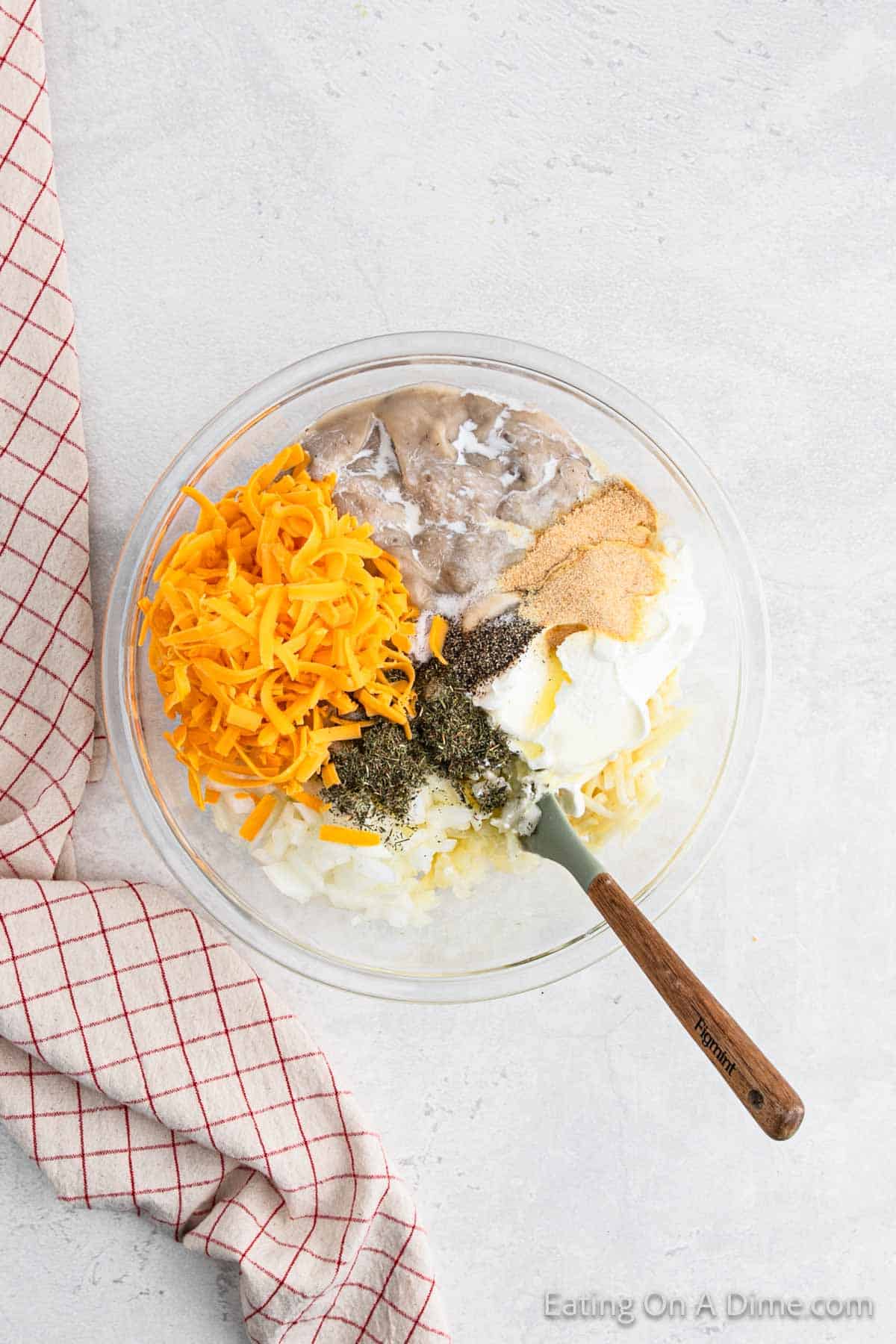 Combining the ingredients in a bowl with a spoon