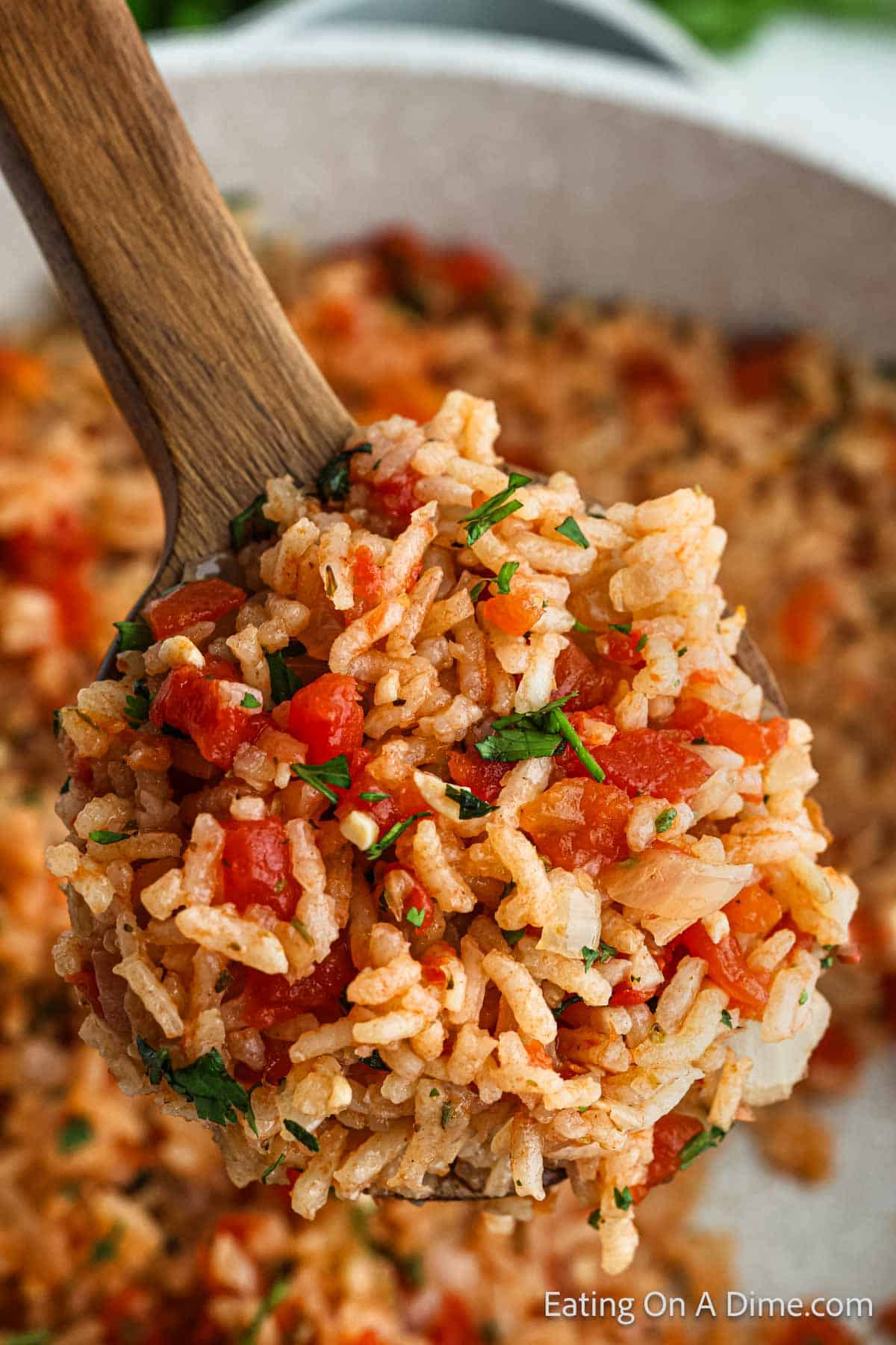 Mexican Rice with a serving on a wooden spoon