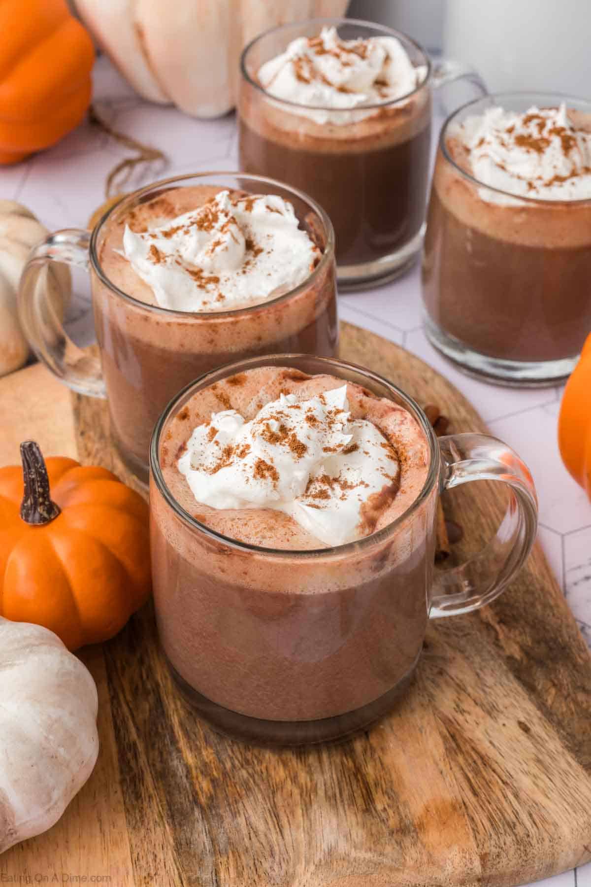 Pumpkin hot chocolate topped with whipped cream and cinnamon