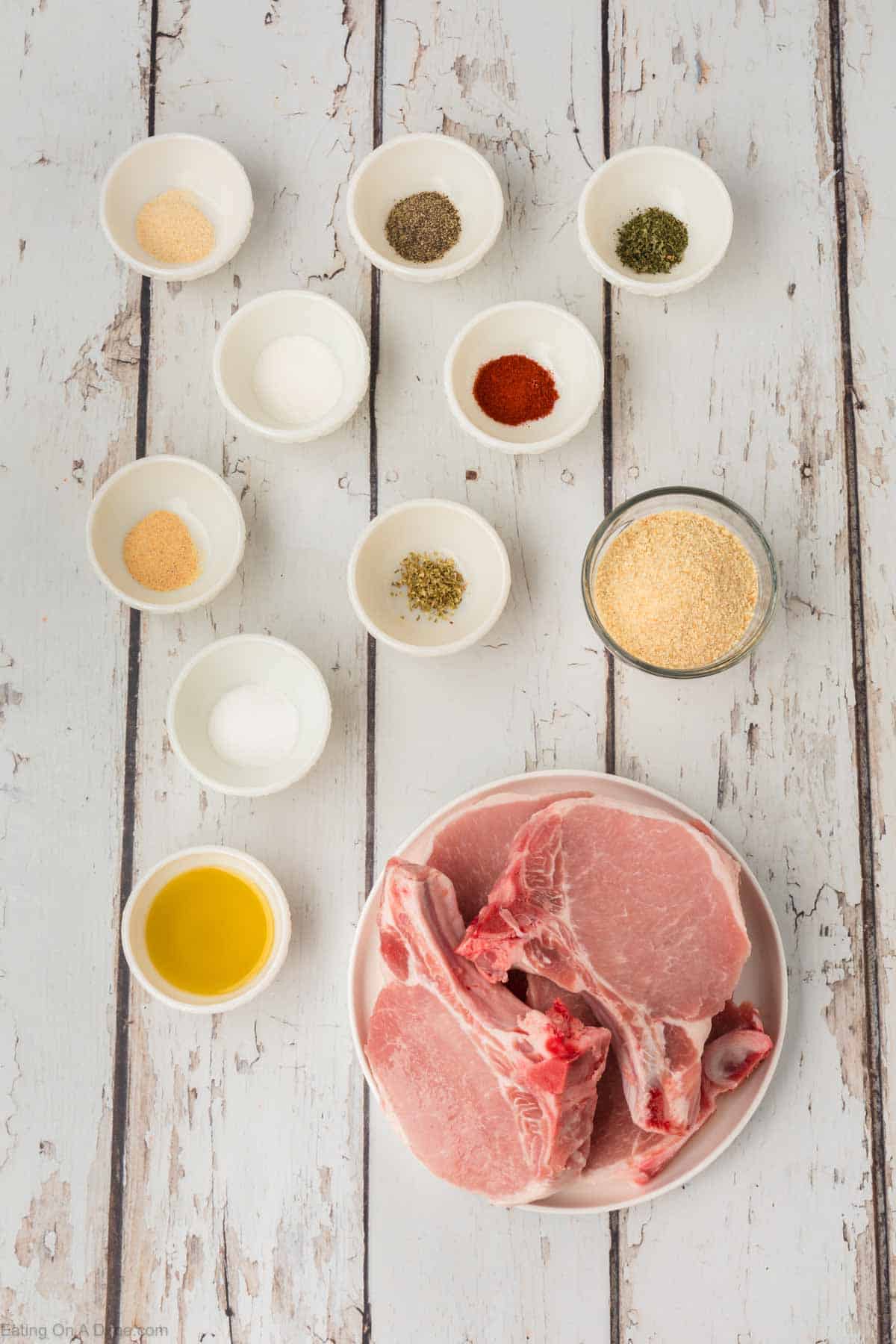 Ingredients - Pork chops, breadcrumbs, salt, sugar, pepper, garlic powder, onion powder, paprika, parsley, oregano, olive oil