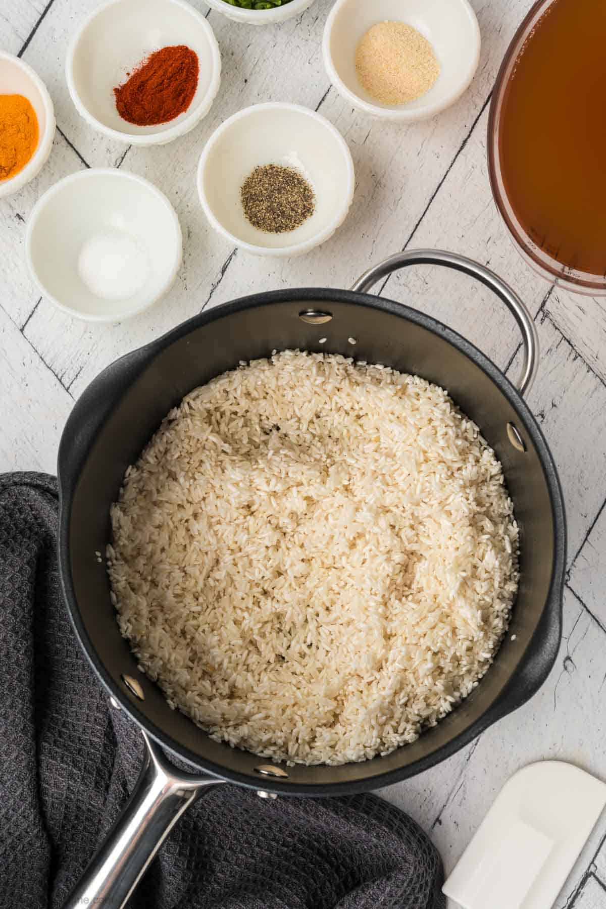 Placing rice in a saucepan