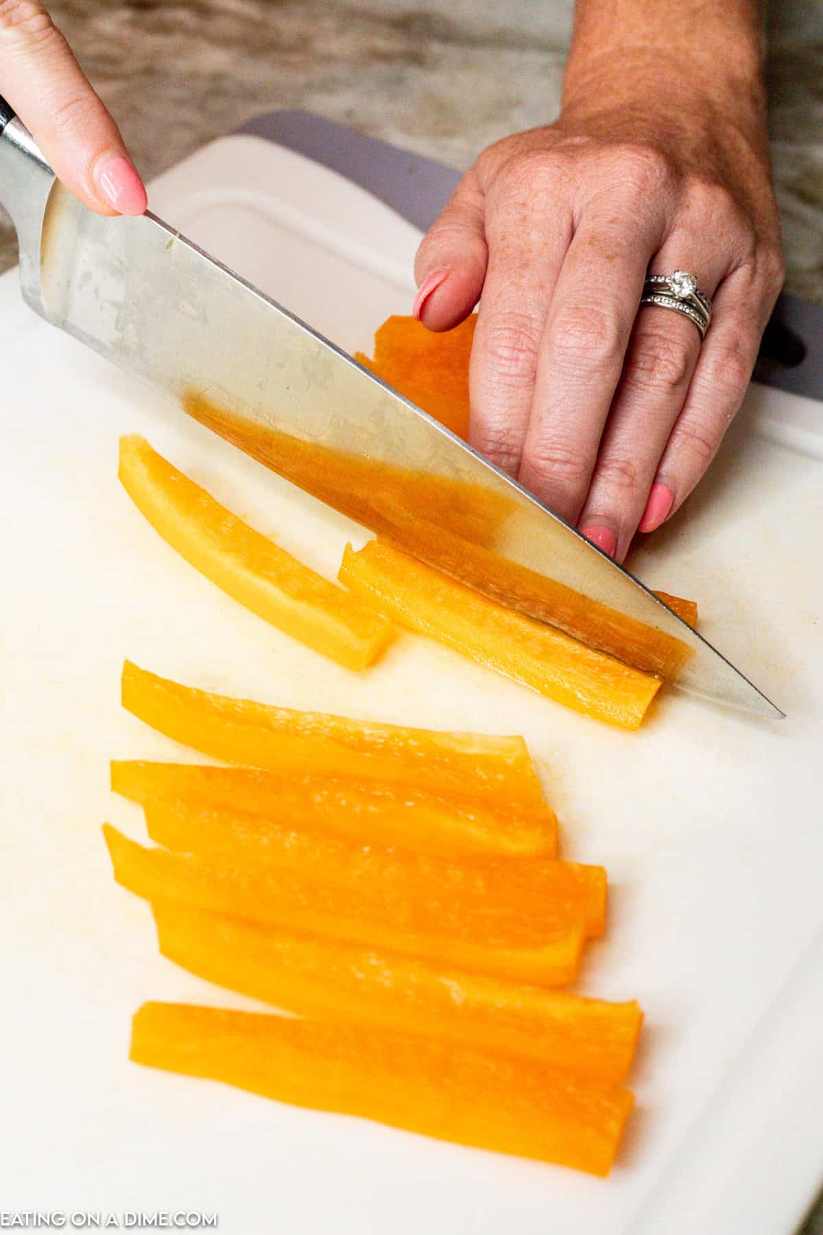 Cutting the bell pepper into strips