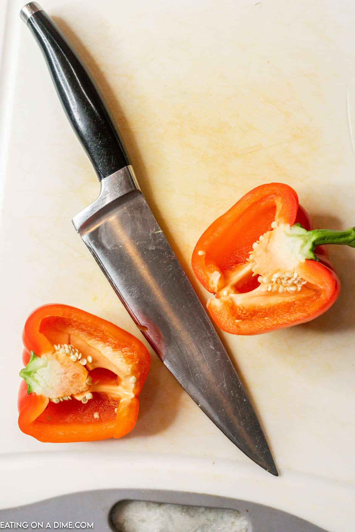 Cutting the red bell pepper in half