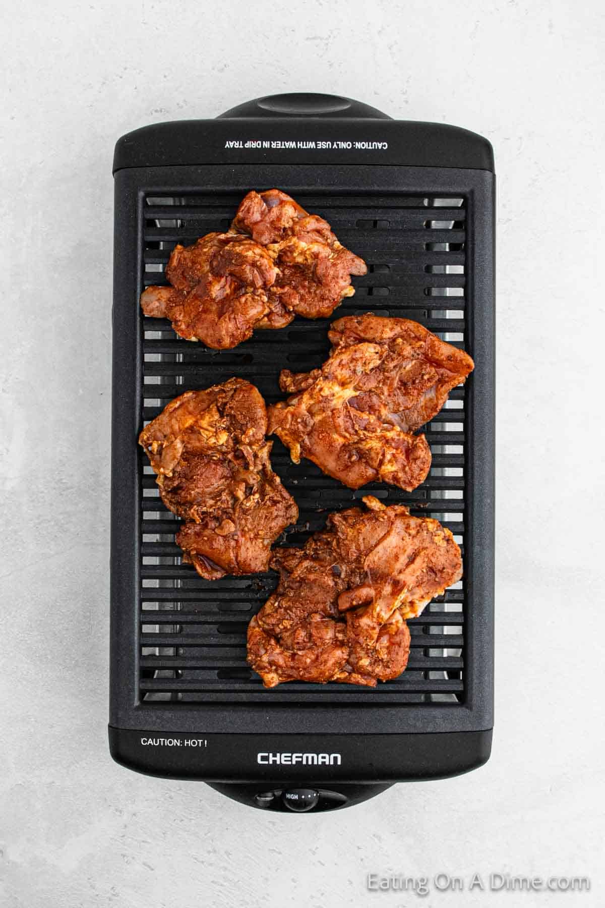 Marinated chicken thighs on a indoor grill