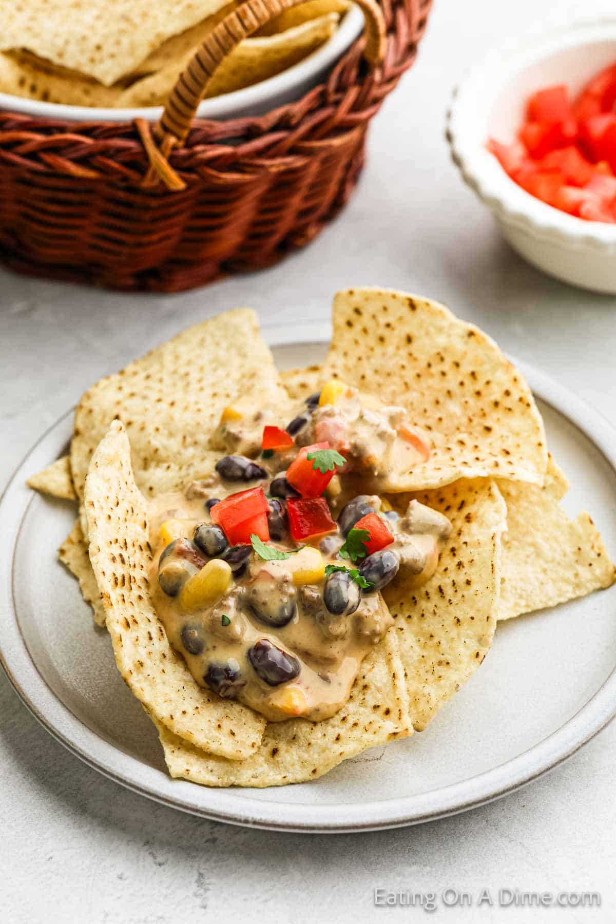 Cowboy Queso topped with tortilla chips on a plate