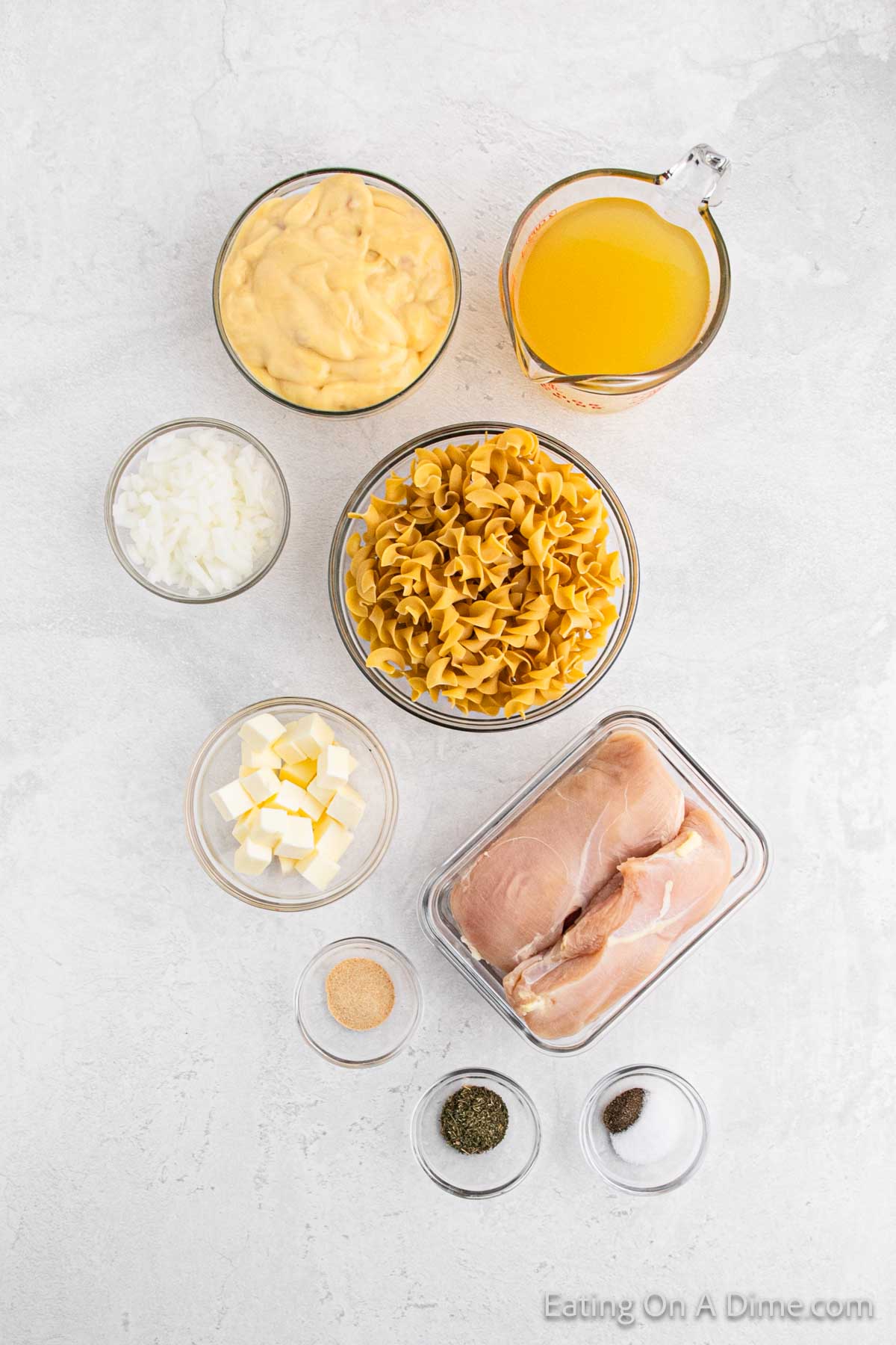 Ingredients - chicken breasts, cream of chicken soup, chicken broth, butter, onion, dried thyme, garlic powder, salt, pepper, egg noodles, parsley