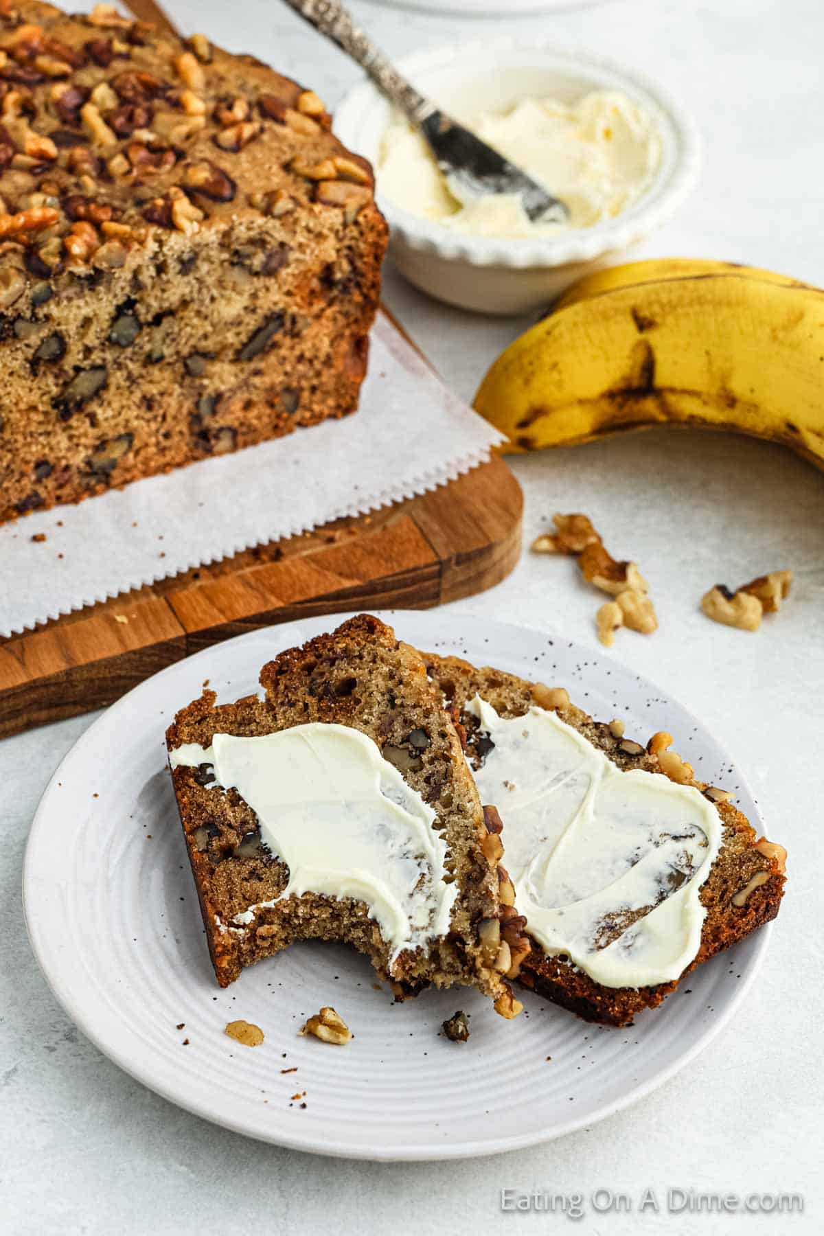 Banana Bread Slices topped with butter on a plate