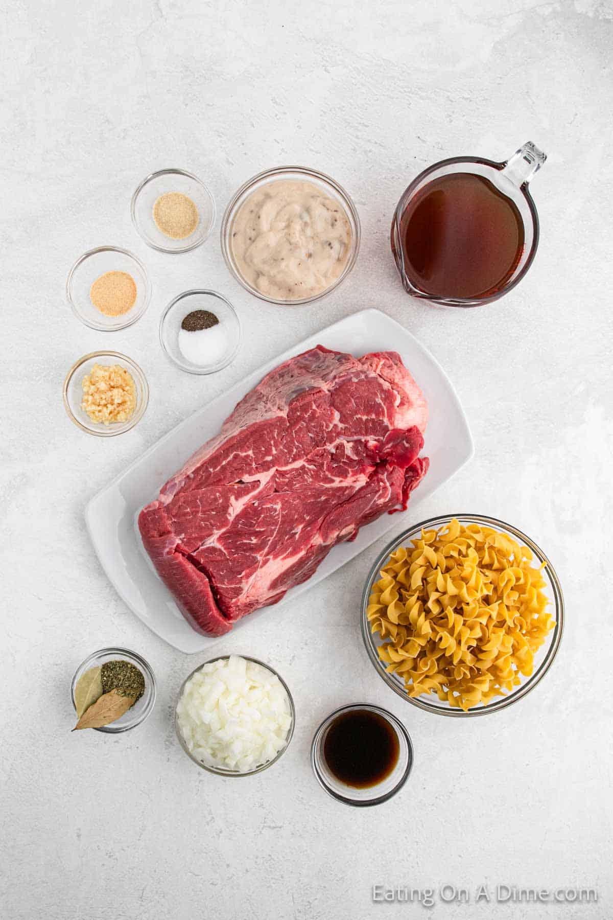 Ingredients - Beef Chuck Roast, onion, garlic, beef broth, cream of mushroom soup, Worcestershire Sauce, Italian Seasoning, Garlic powder, onion powder, salt, pepper, bay leaves, egg noodles