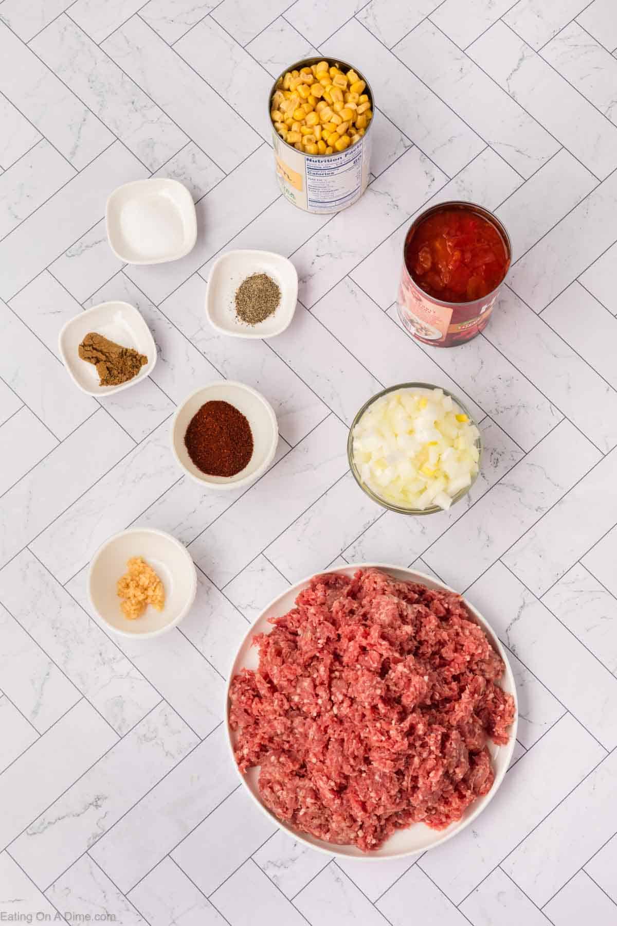 Ingredients - Ground beef, onion, garlic, diced tomatoes, corn, chili powder, cumin, salt, pepper