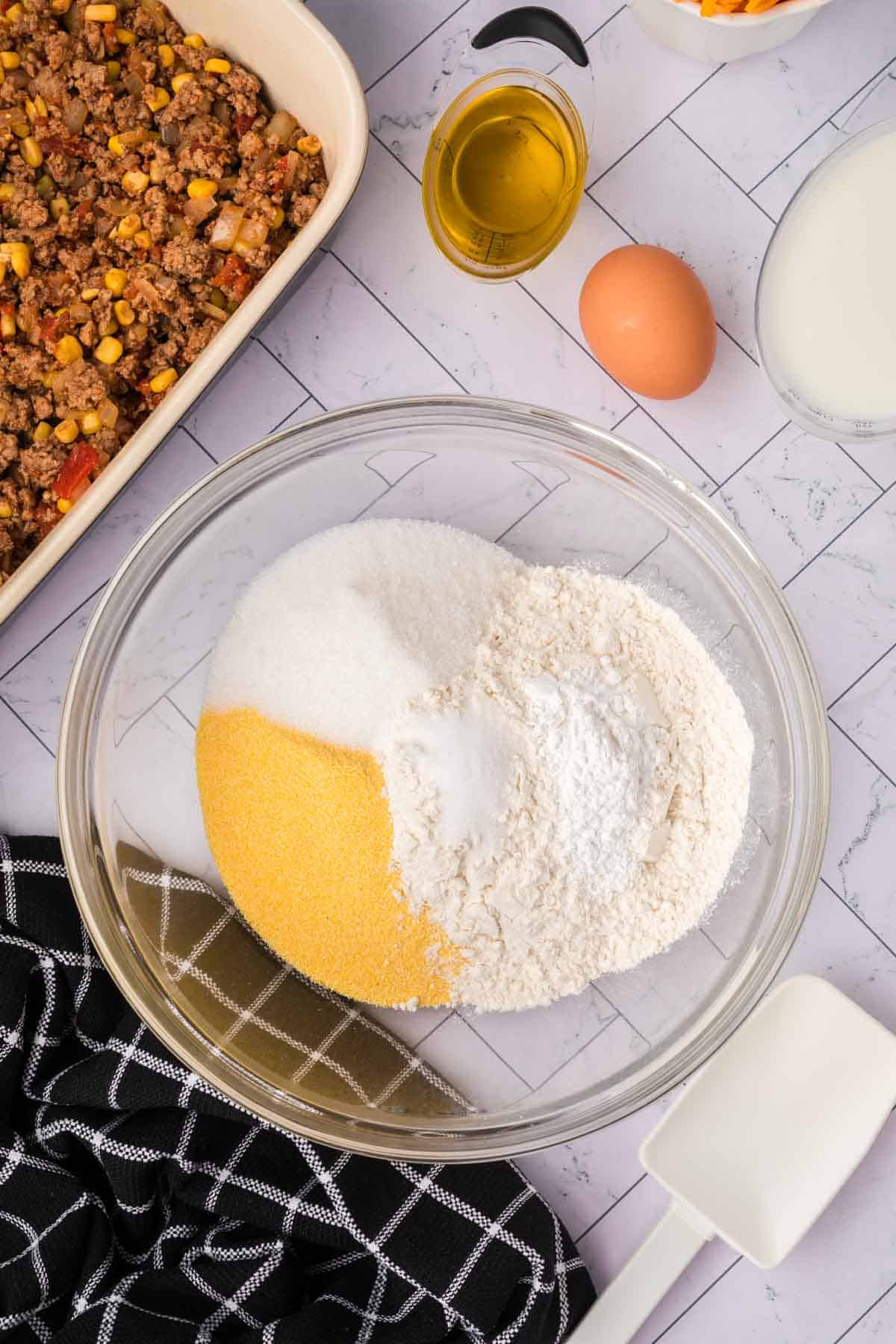 Combining the dry ingredients for the cornbread in a bowl