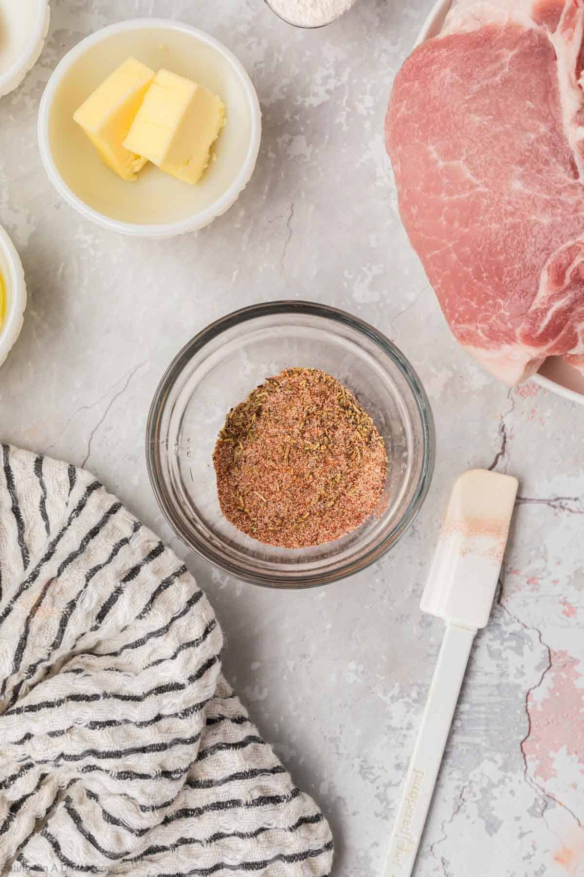 Combining the seasoning in a small bowl with a small bowl of butter on the side