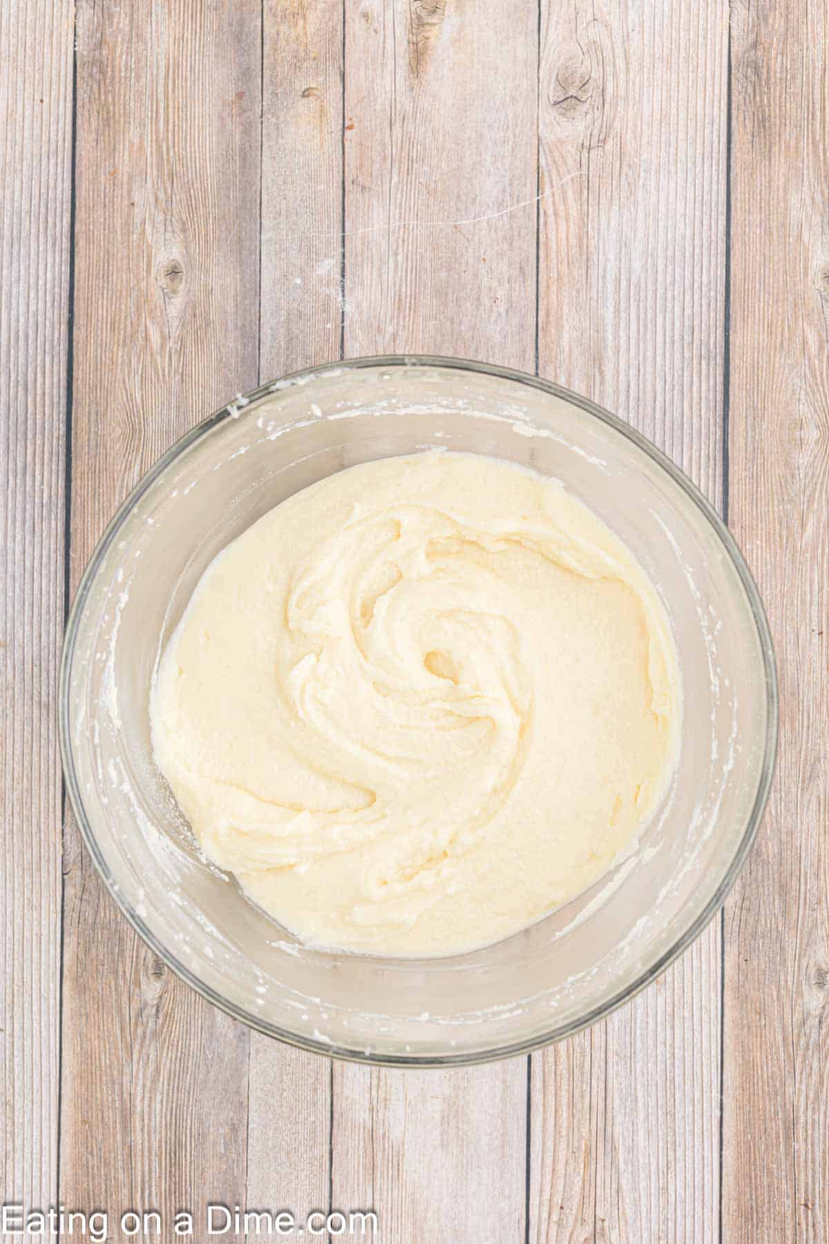 Frosting ingredients blended together in a bowl