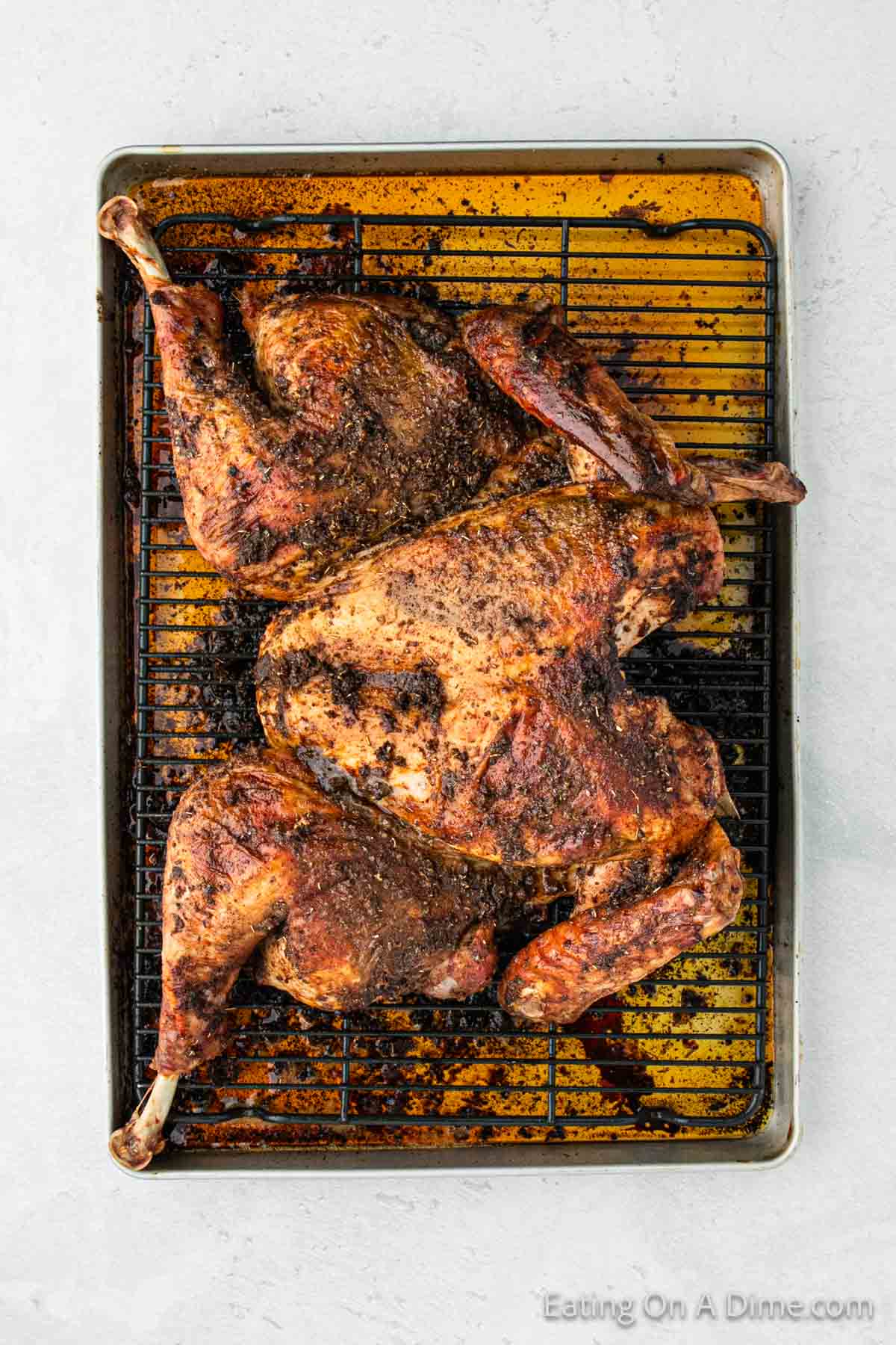 Cooked Spatchcock Turkey on a roasting pan