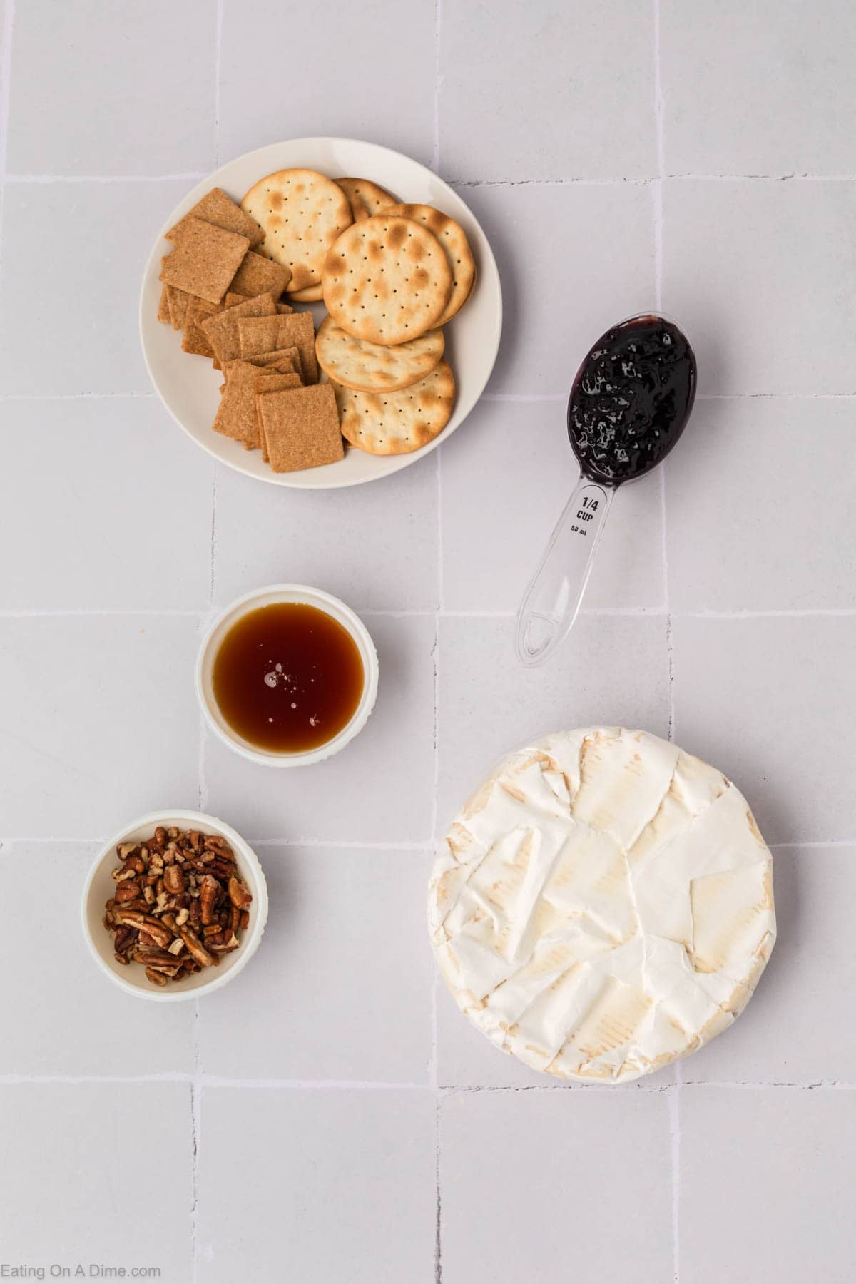 Wheel of Brie, jelly, pecans, honey, crackers