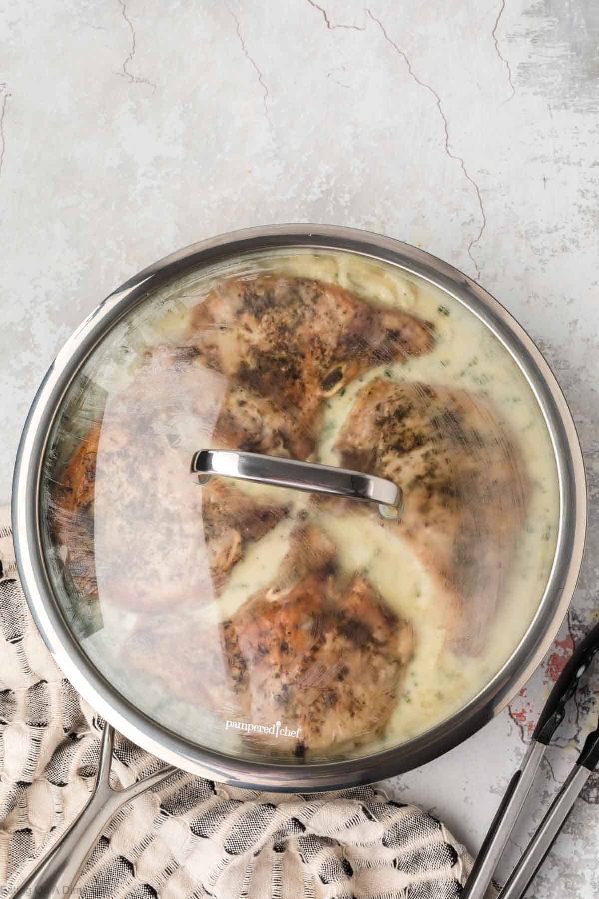 Lid on skillet over the pork chops and gravy