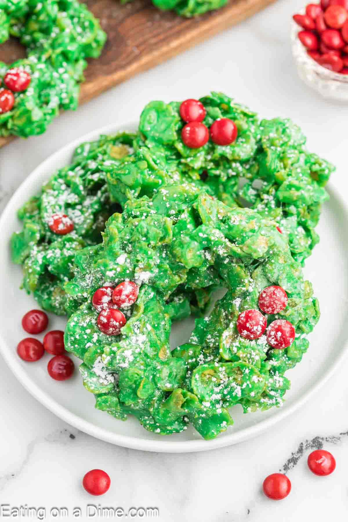 Green Christmas Wreath topped red candy and stacked on a plate