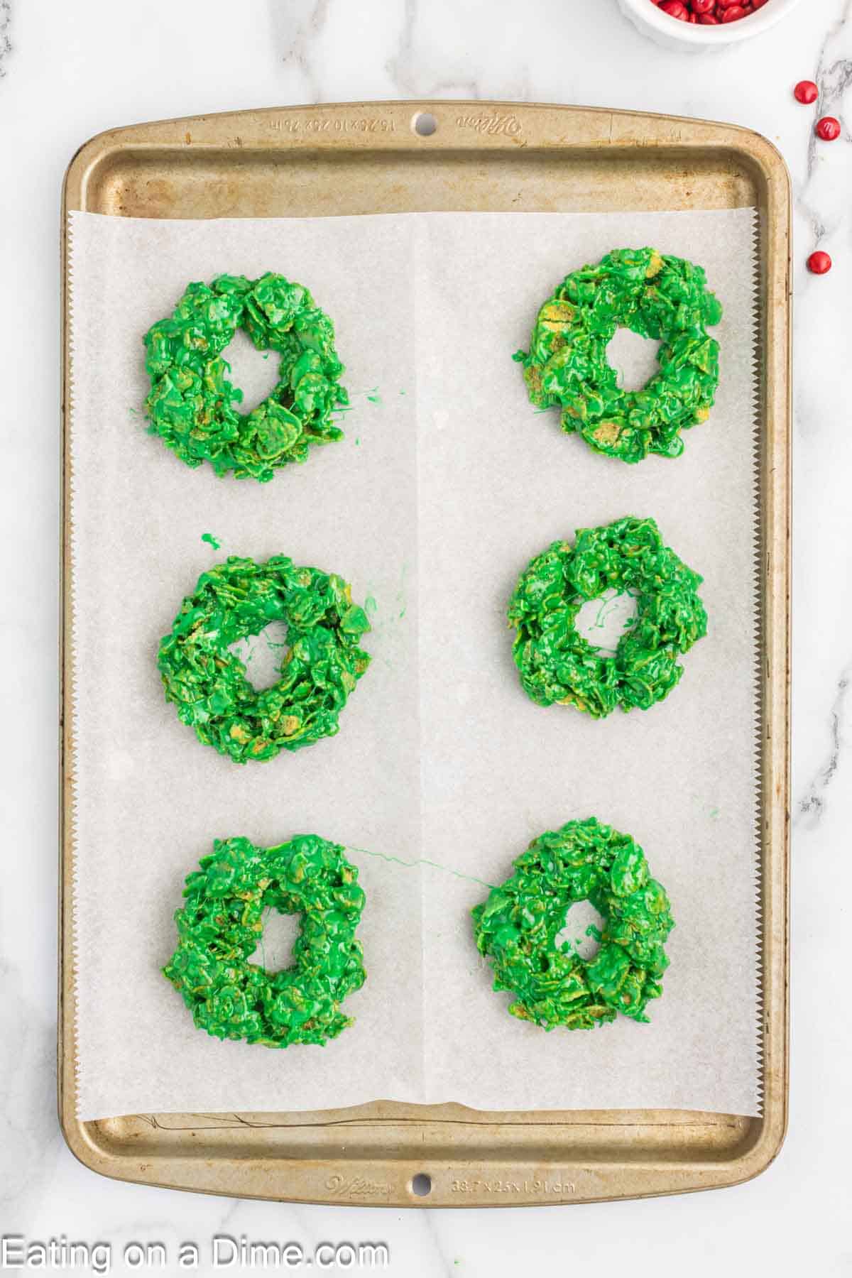 Green Cereal Mixture shaped into a wreath on a baking sheet lined with parchment paper