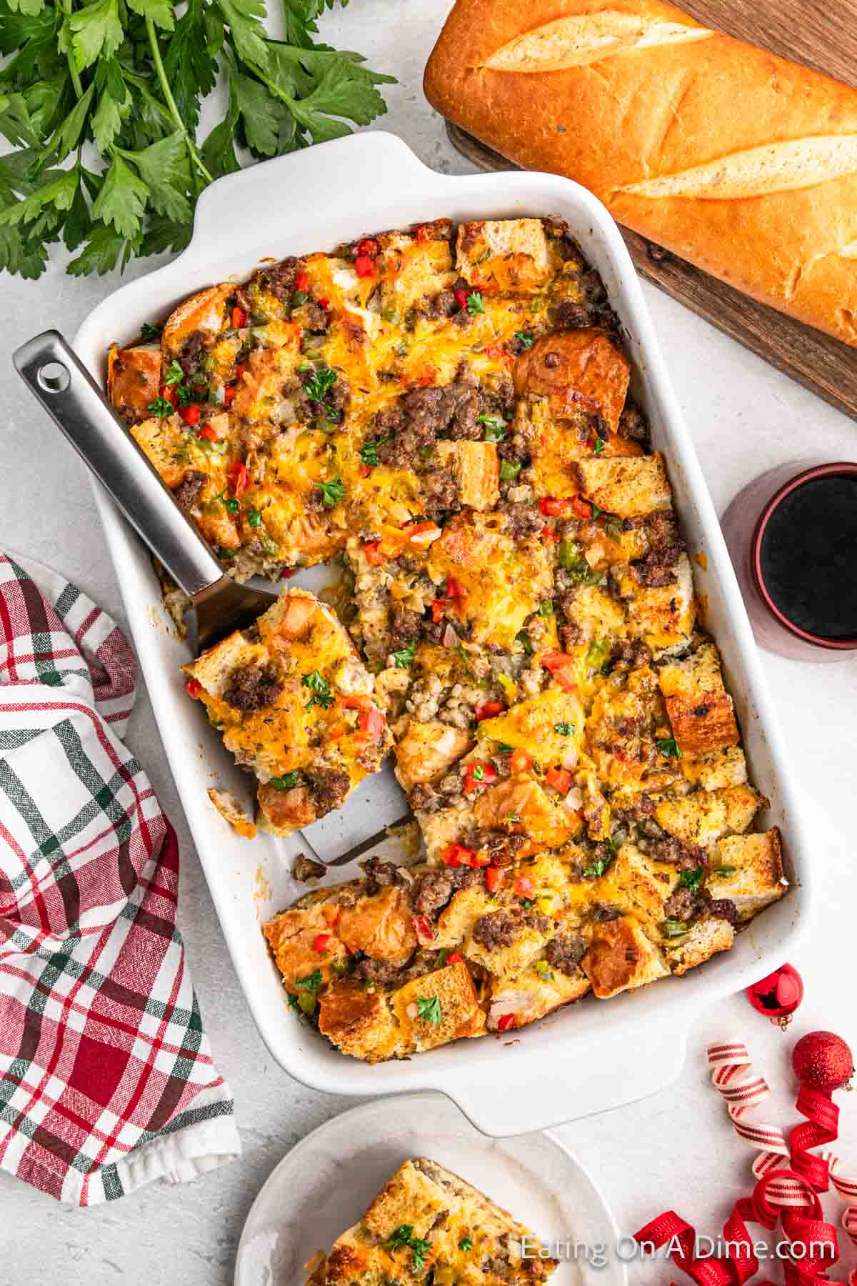 Breakfast Casserole in a baking dish with a serving on a spatula