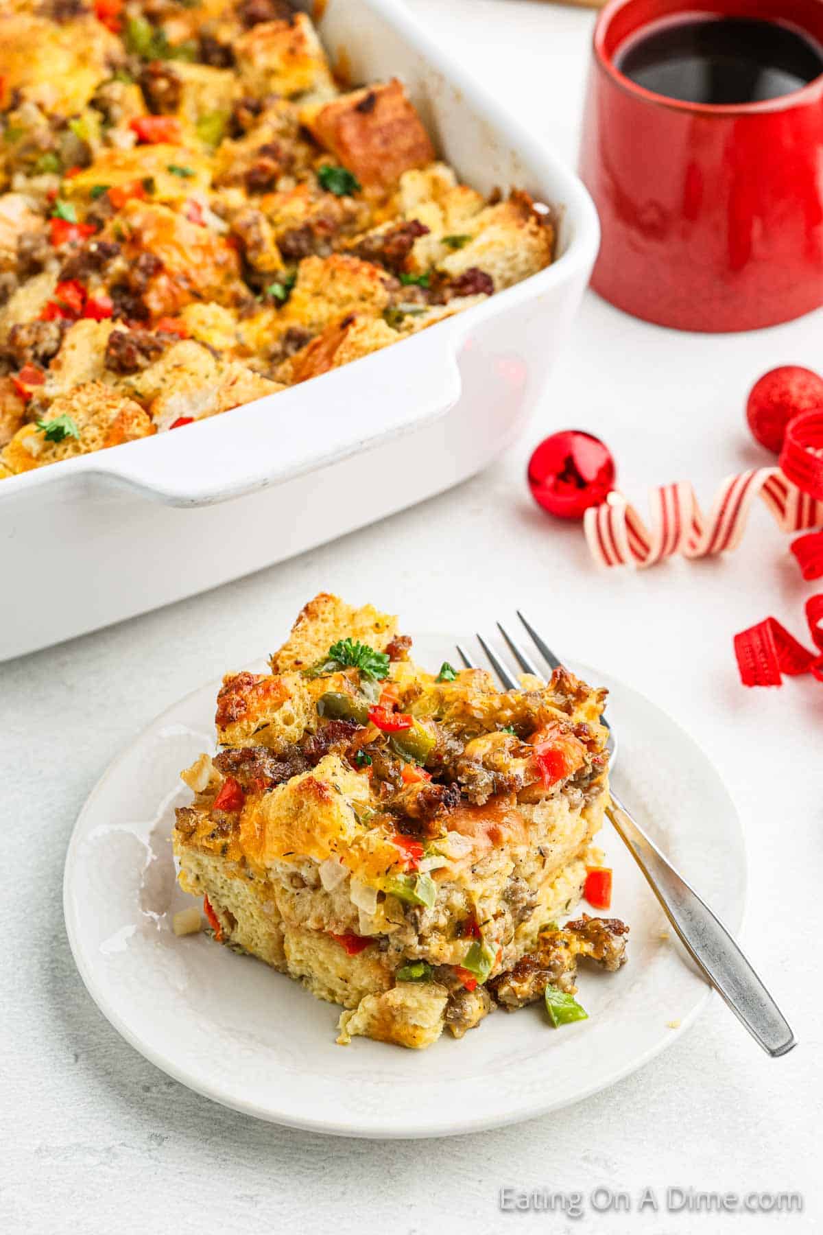 Serving of breakfast casserole on a plate with a fork