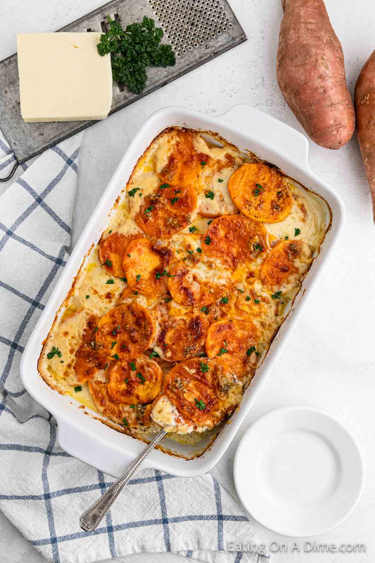 Baked Sweet Potato Au Grating in a white baking dish