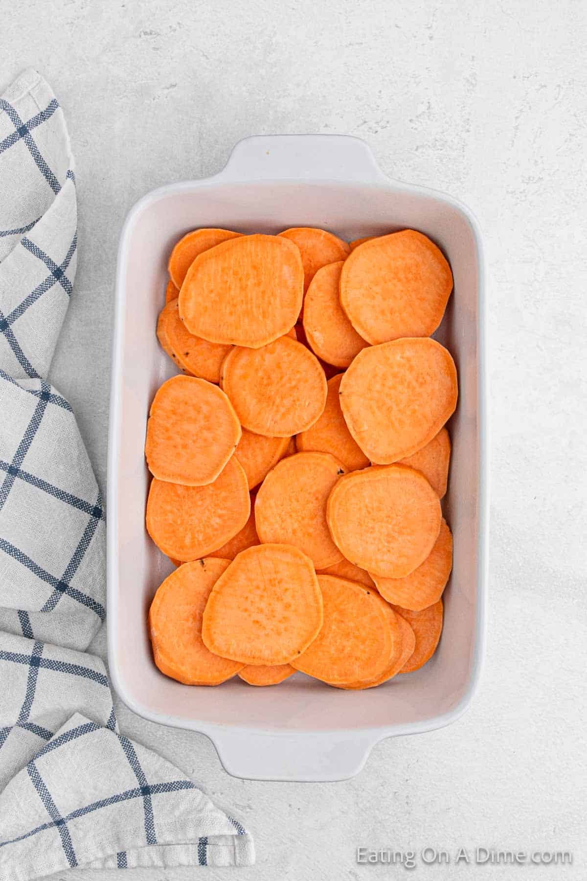 Sliced Sweet Potatoes in a baking dish