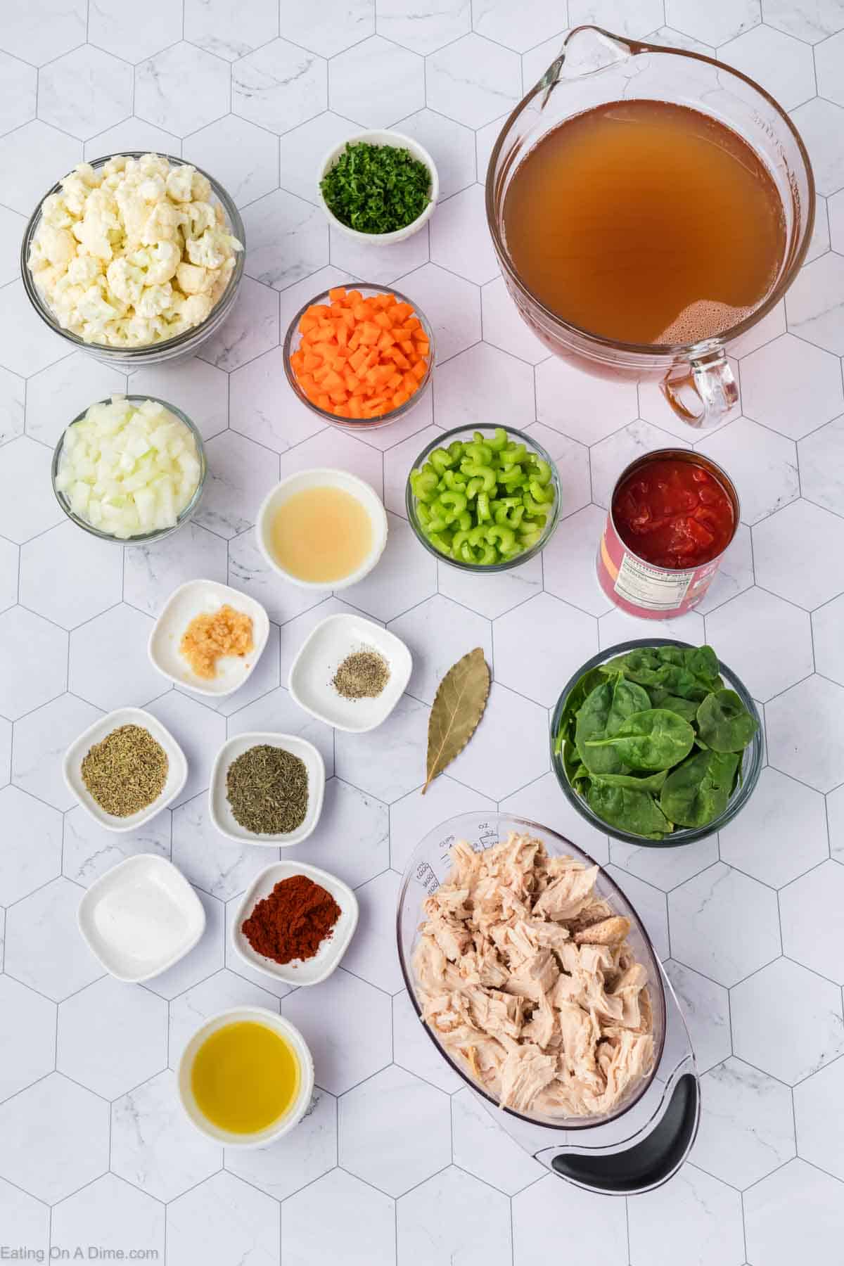 Ingredients - Olive oil, onion, celery, carrots, garlic, leftover turkey, cauliflower, chicken broth, diced tomatoes, thyme, rosemary, salt, paprika, pepper, bay leaf, spinach lemon juice, parsley