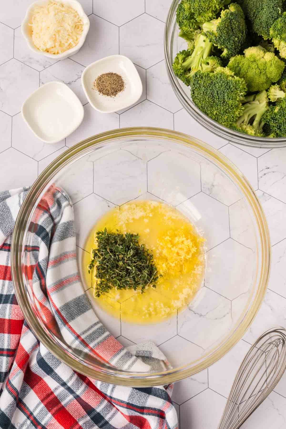 Olive, melted butter, lemon zest, and thyme mixed in a bowl