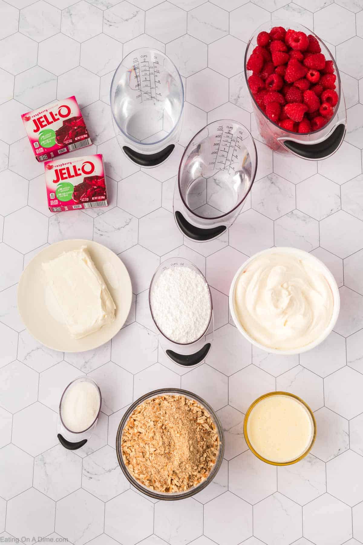 Ingredients - Pretzels, sugar, butter, cream cheese, powdered sugar, whipped topping, raspberry gelatin, water, fresh raspberries