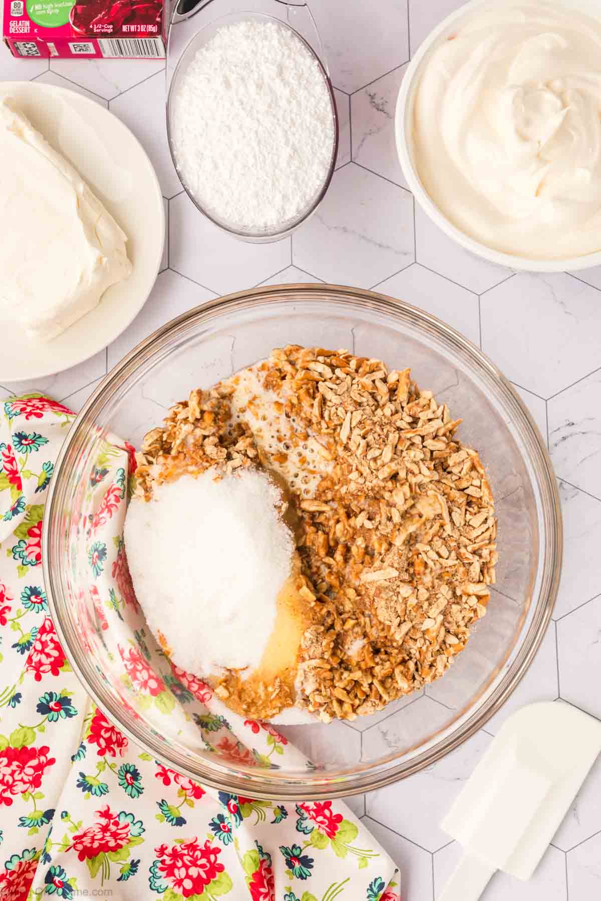 Crushed Pretzels in a bowl with sugar, and melted butter