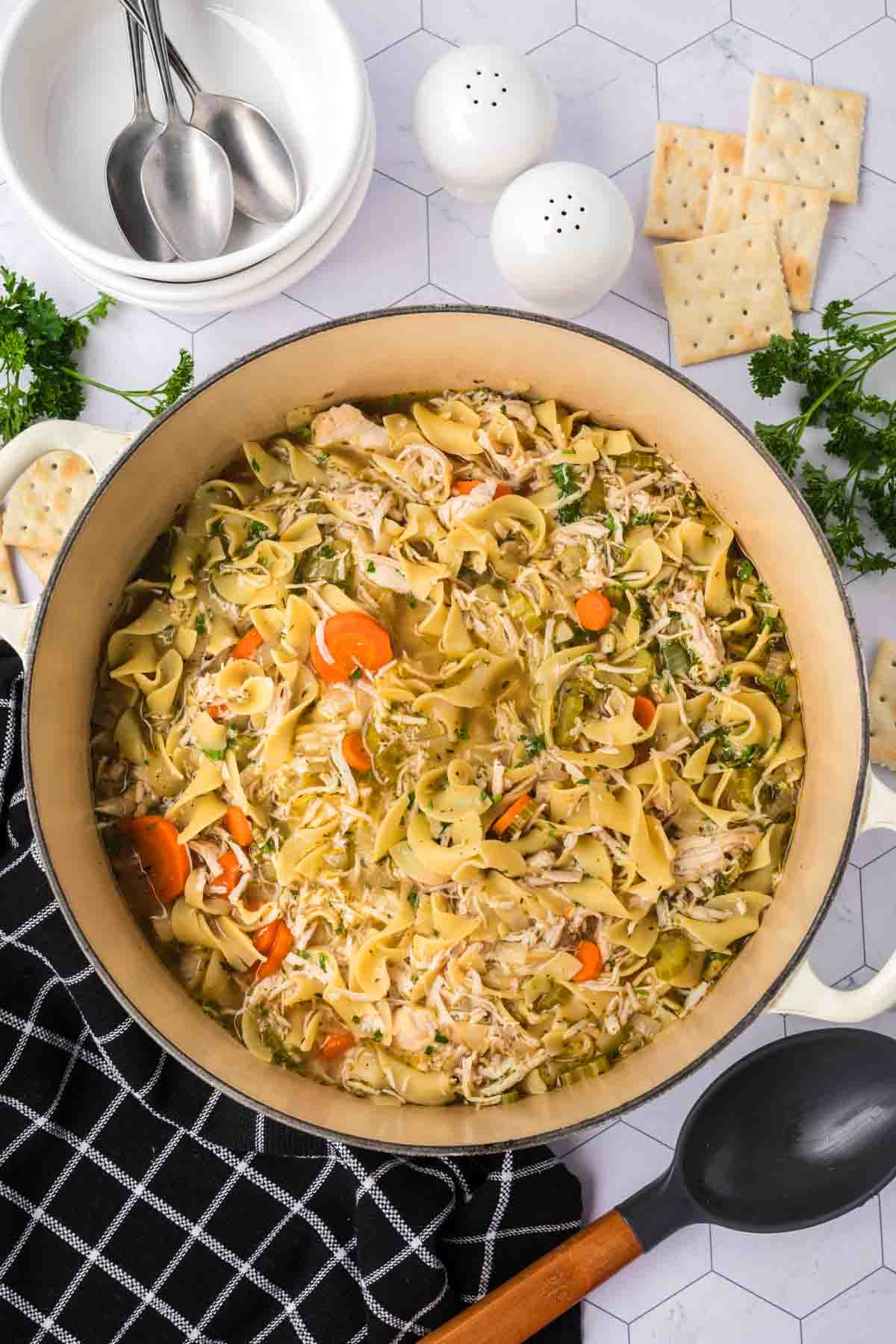 Turkey Noodle Soup in a Large pot with slice carrots and celery