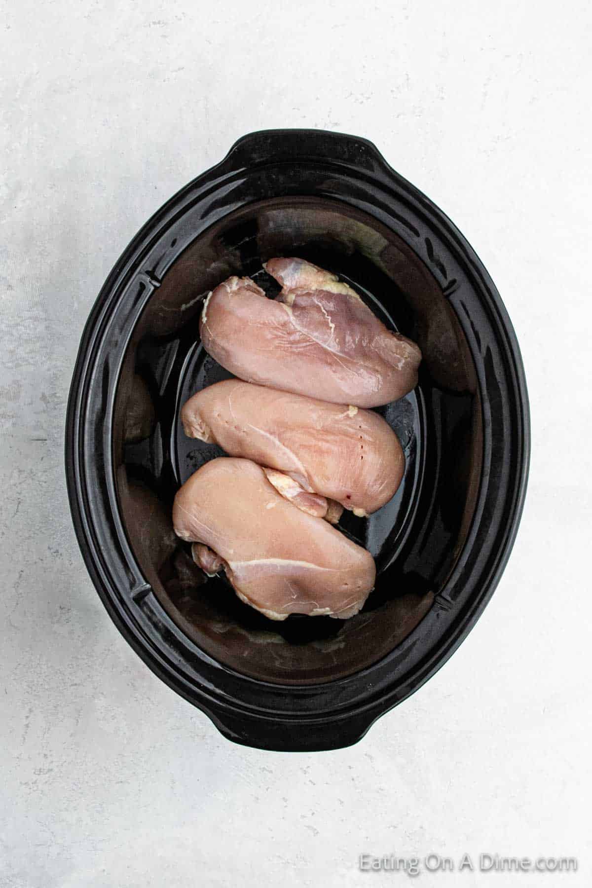 Chicken breast placed in the slow cooker