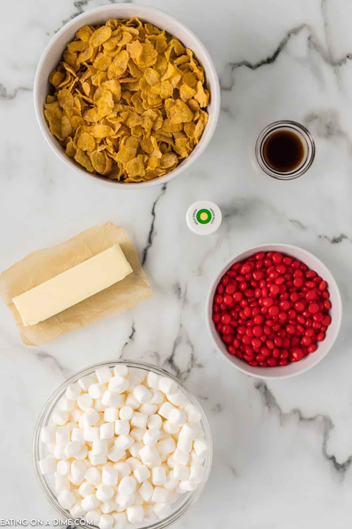 Ingredients - Corn Flakes Cereal, butter, mini marshmallows, vanilla extract, green food coloring, mini red M&Ms