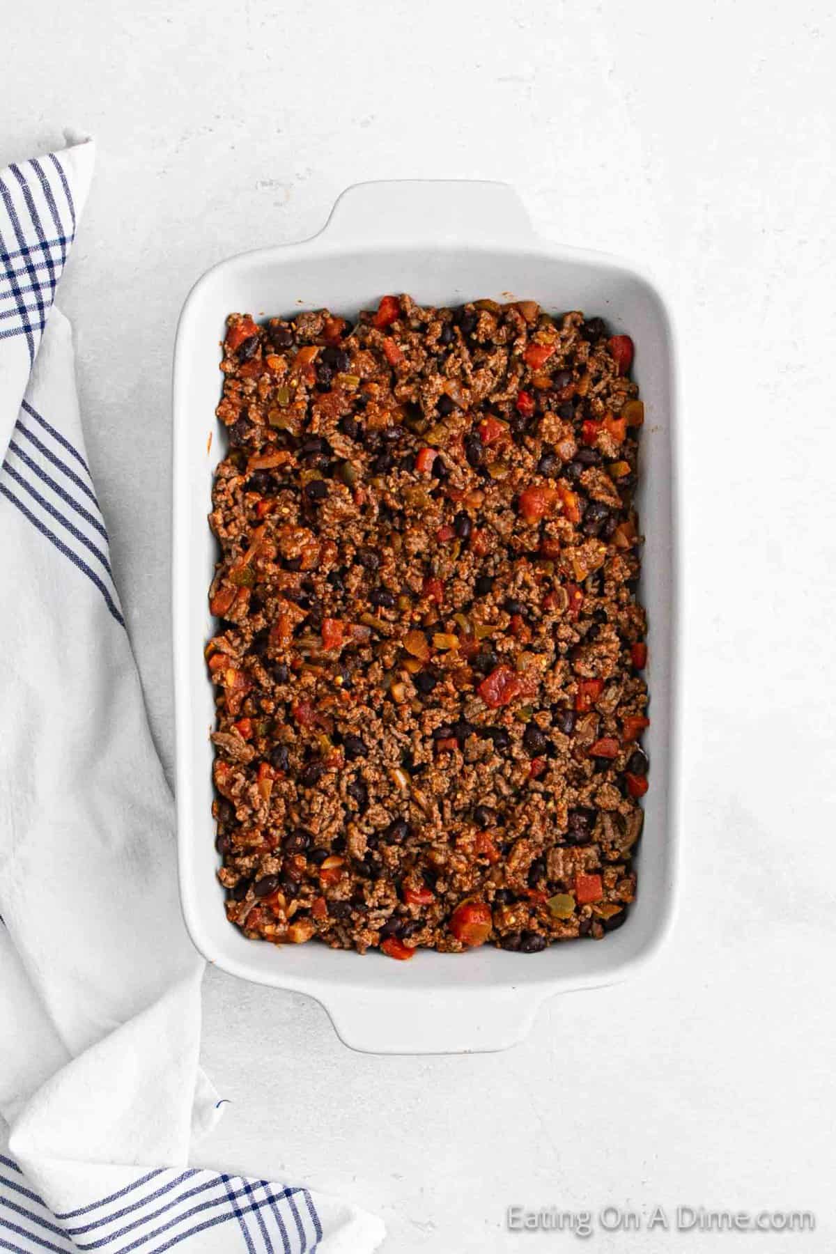 Ground beef mixture layered in a baking dish