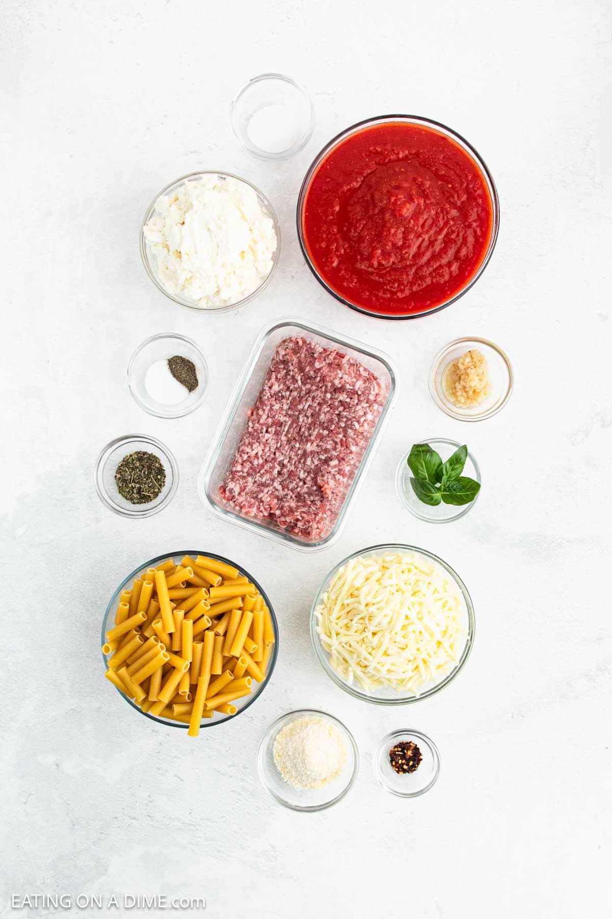 Ingredients - Ground Sausage, garlic, Italian Seasoning, Crushed Tomatoes, salt, sugar, red pepper flakes, pepper, ziti pasta, ricotta cheese, mozzarella cheese, parmesan cheese, basil