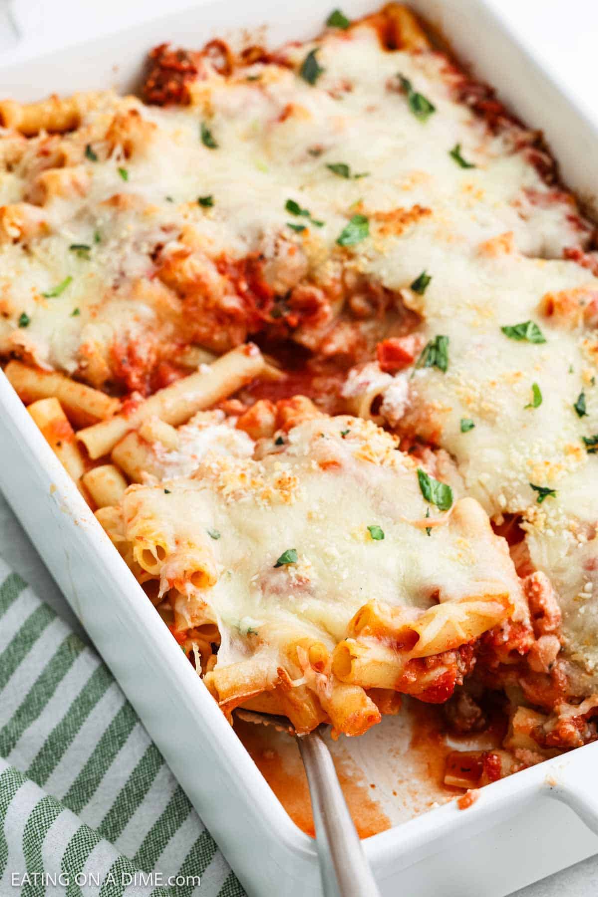 Baked Ziti in a baking dish topped with melted cheese 