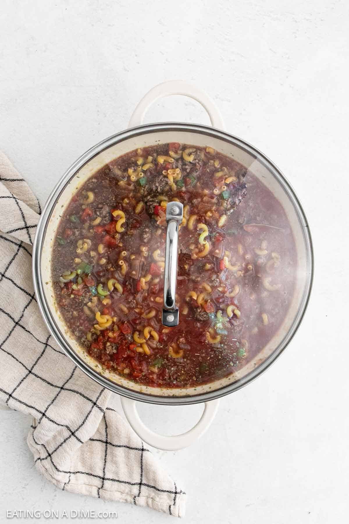 Large pot of Goulash topped with a lid