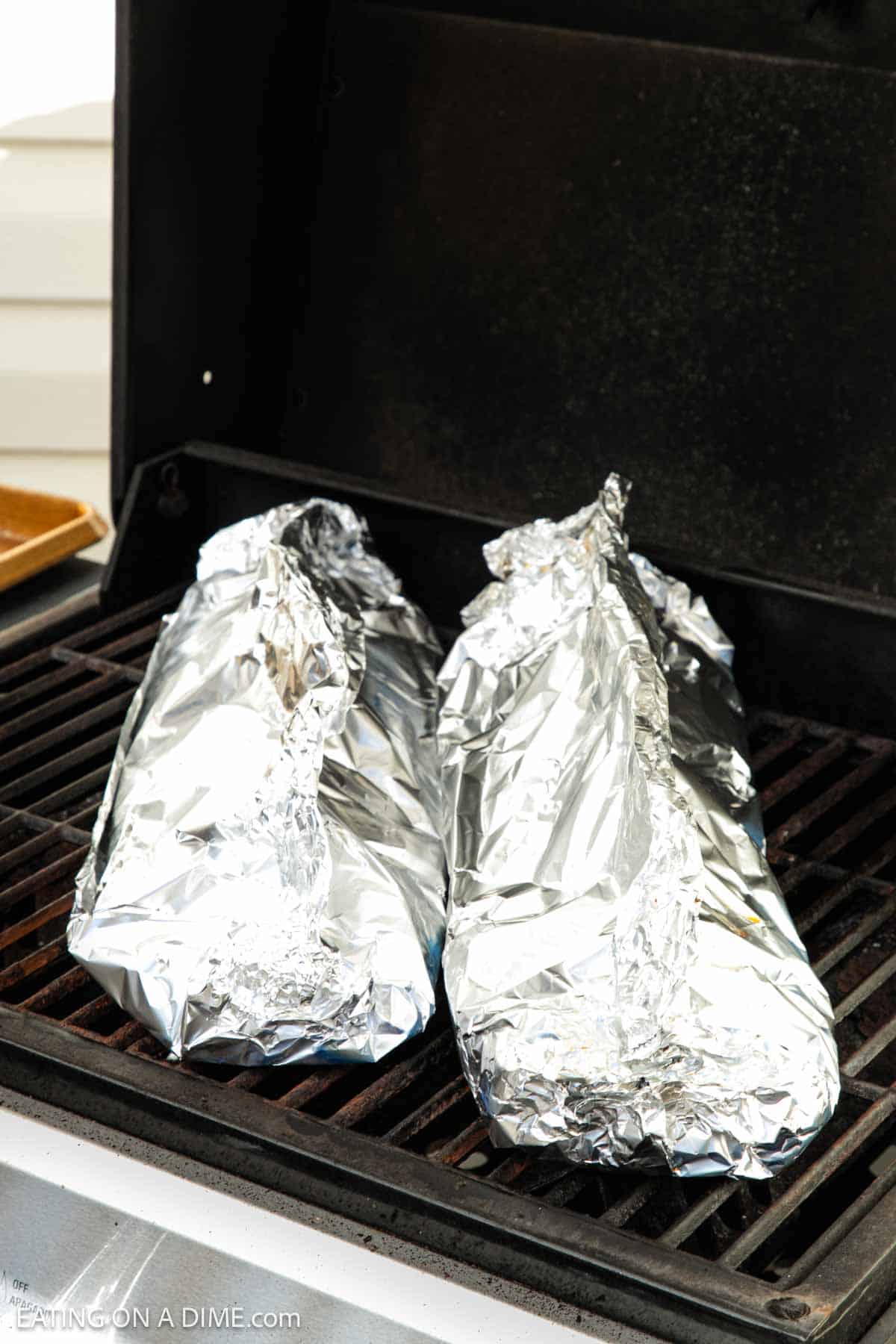 Foil wrapped ribs on the grill