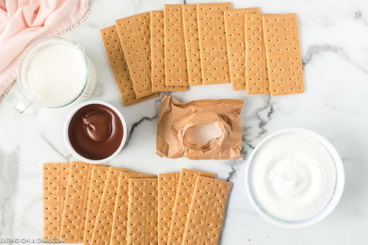 Ingredients - Graham Crackers, Chocolate Frosting, Vanilla Pudding Mix, Milk, and Cool Whip